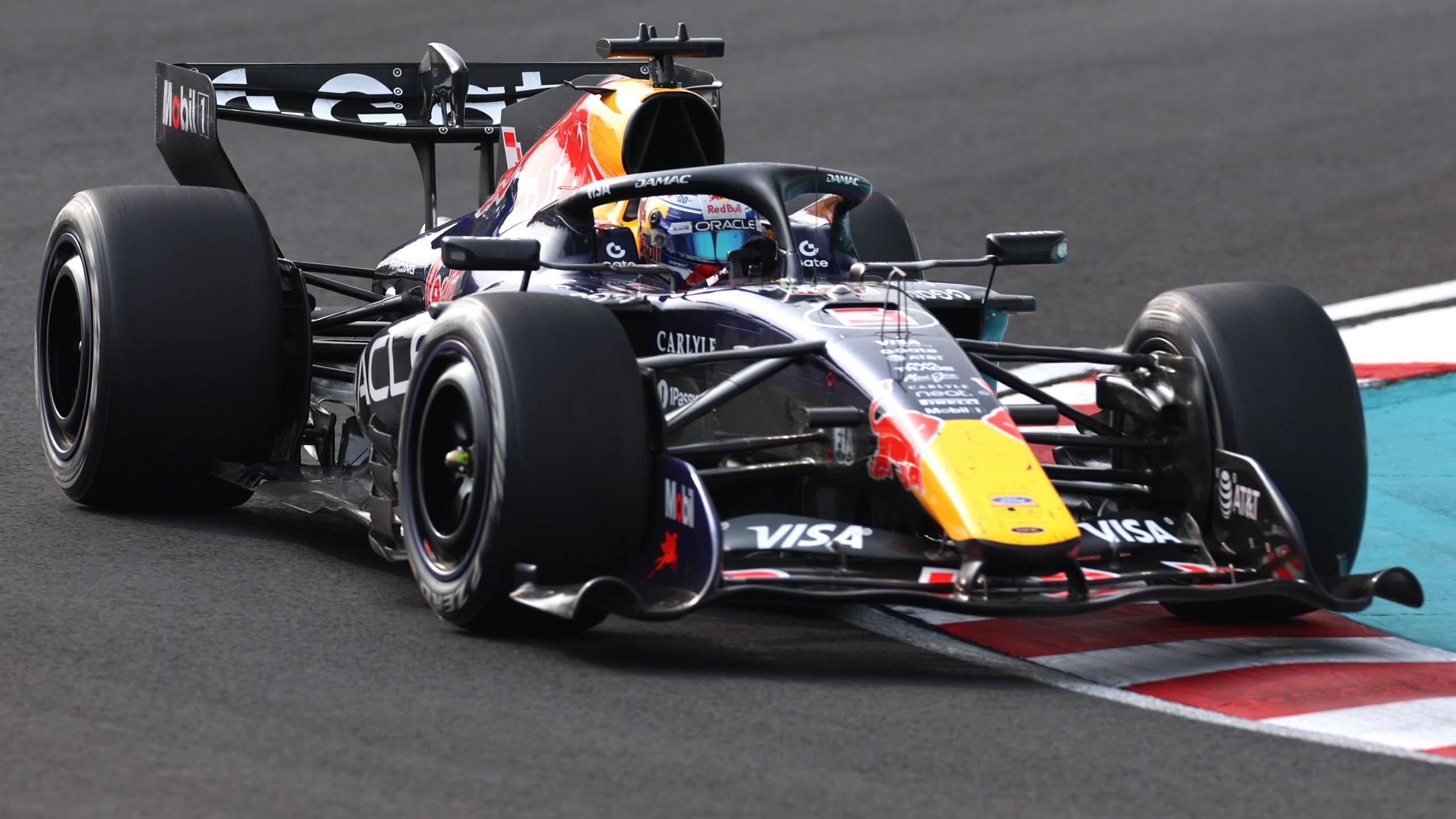 Red Bull's Max Verstappen drives across a kerb during the 2026 Japanese Grand Prix