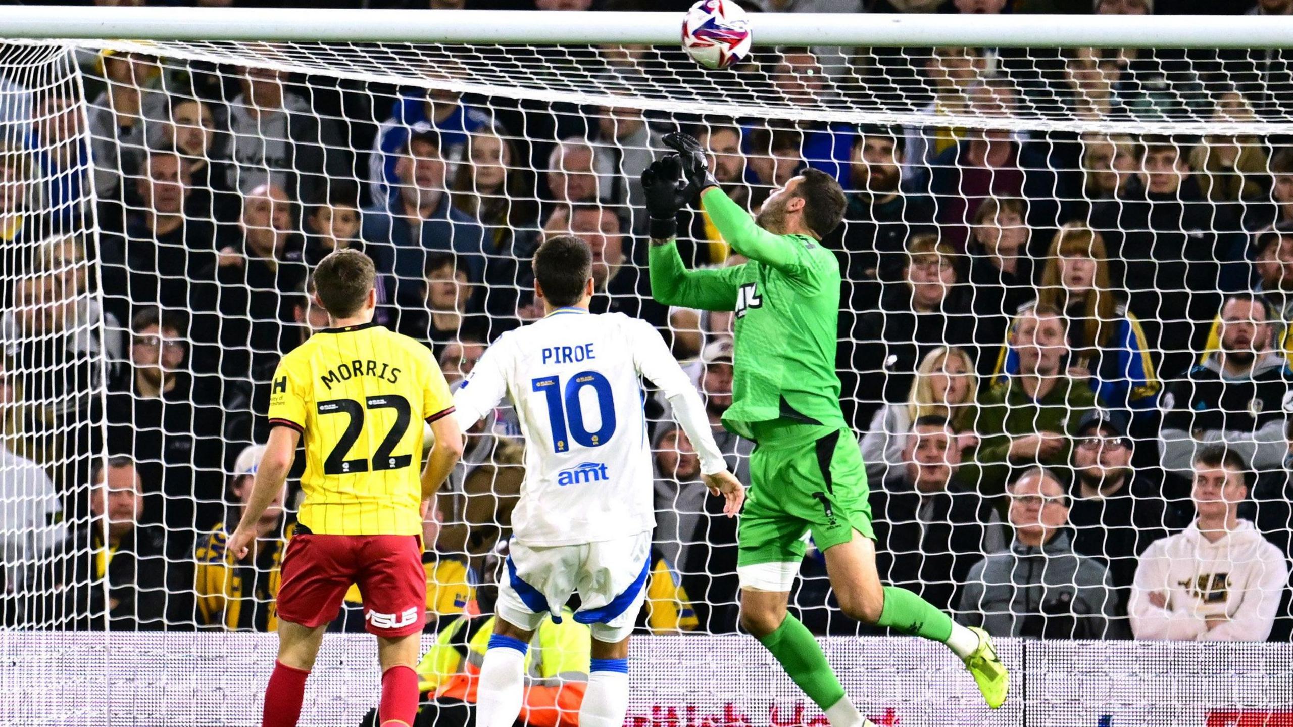 Watford goalkeeper Daniel Bachmann spills Largie Ramazani's shot in