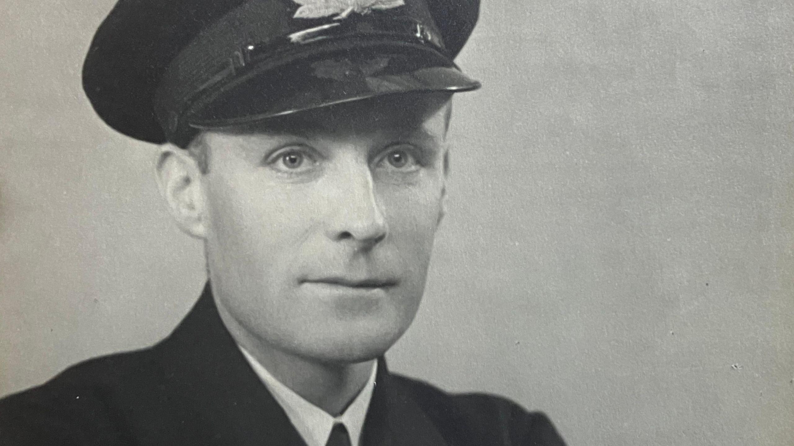 Black and white portrait photograph of Sub-lieutenant Victor Todd, wearing service cap and jacket