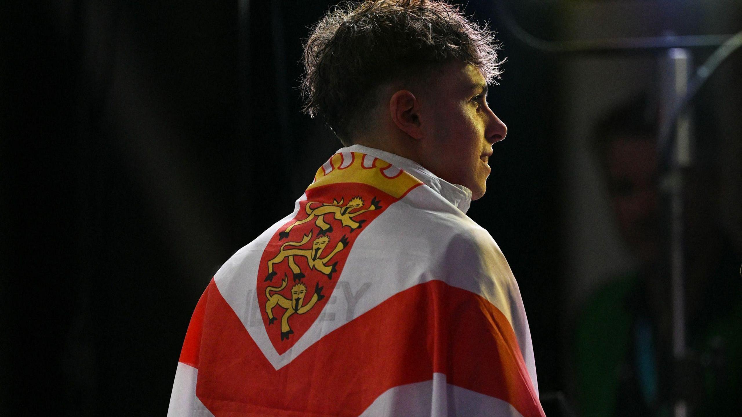 Filip Nowacki with the Jersey flag draped around his back