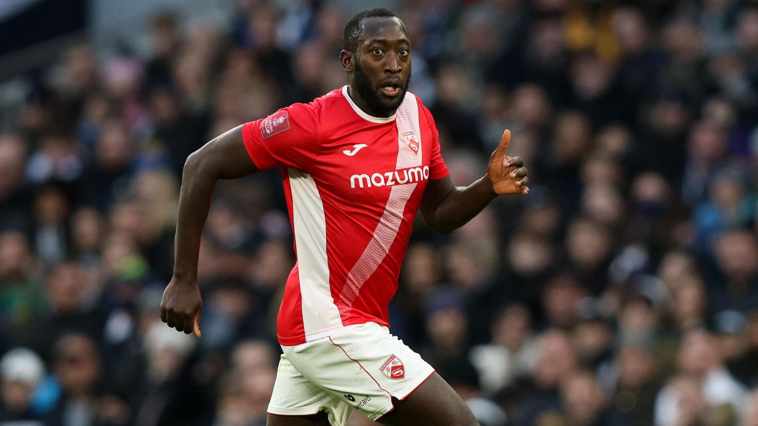 Toumani Diagouraga in action for Morecambe in January 2022