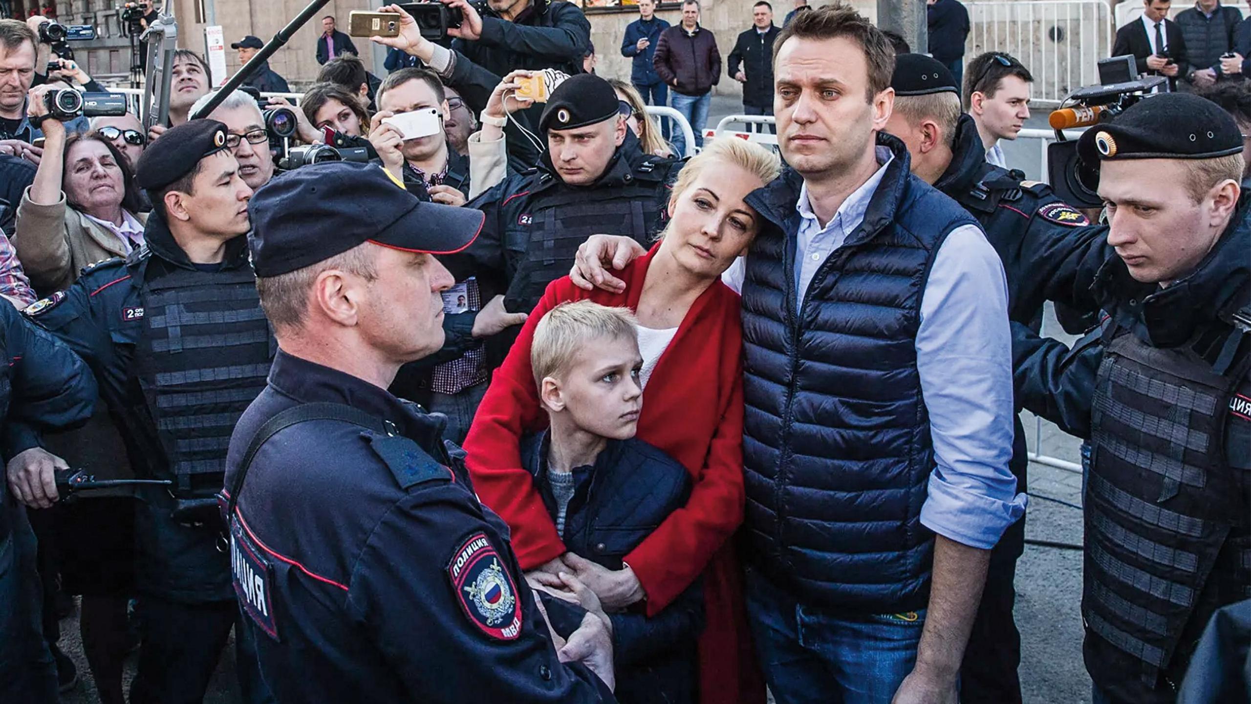 Alexei, Yulia and their son Zakhar at a rally in Moscow in 2017, surrounded by police