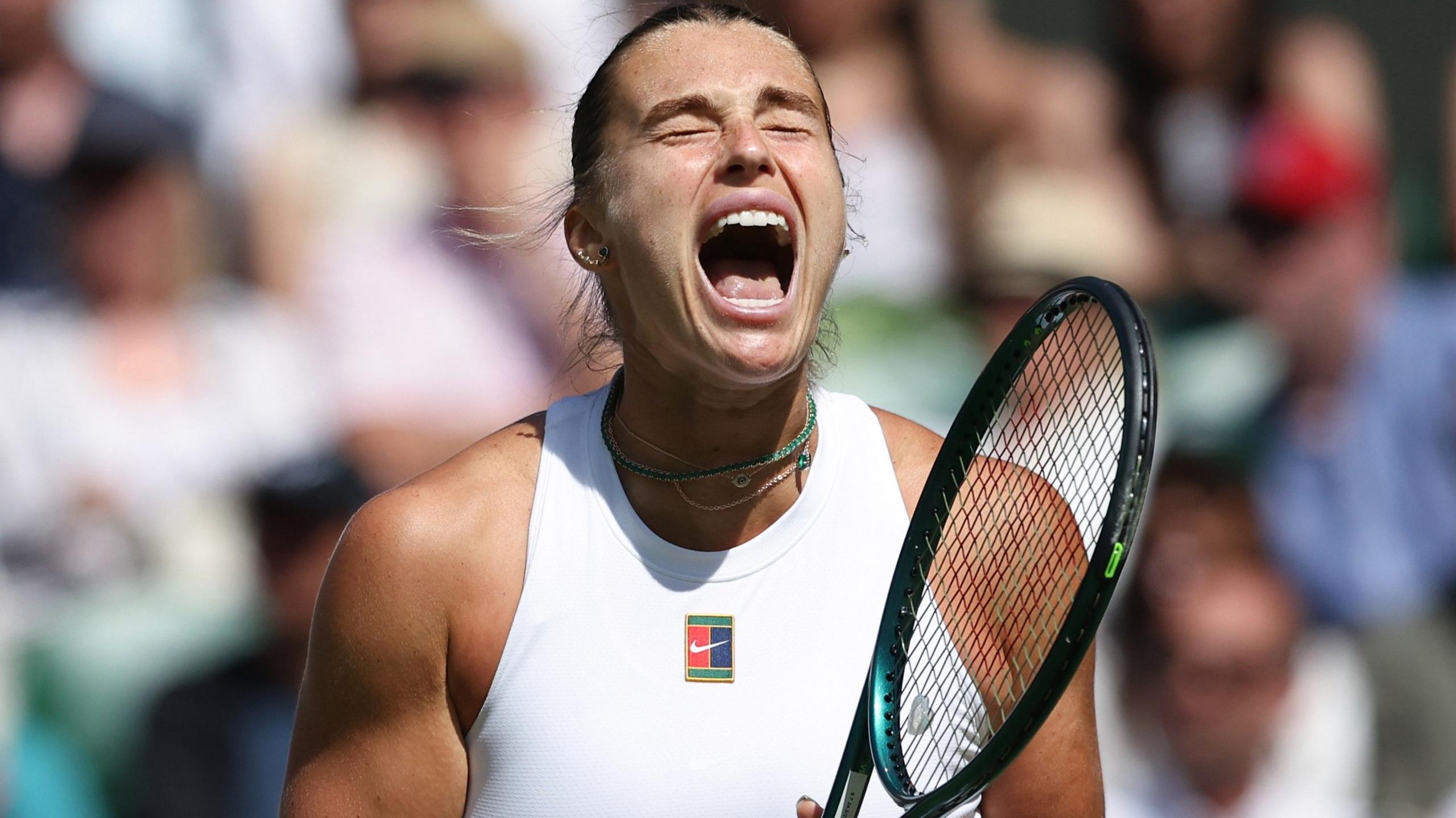 Aryna Sabalenka roars in celebration after beating Laura Siegemund at Wimbledon