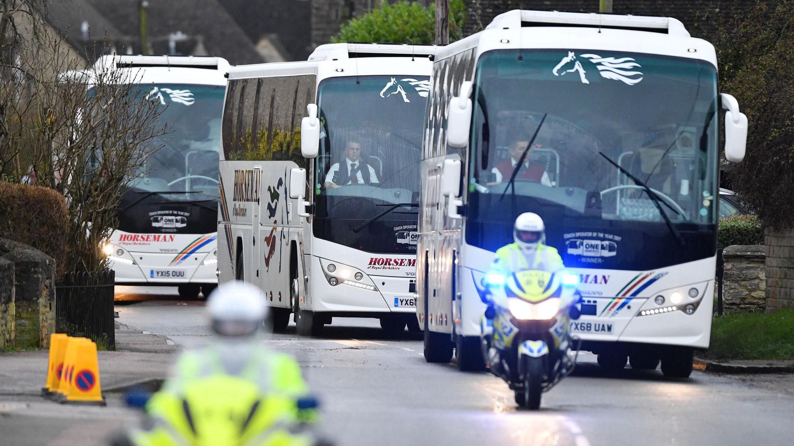 Police outriders leading the convoy of coaches as they left RAF Brize Norton heading for Arrowe Park Hospital, carrying UK passengers who had just landed after an evacuation flight from Wuhan, China