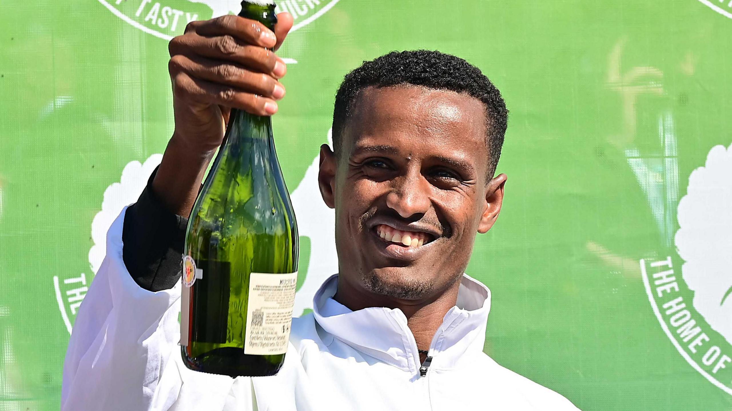 Ethiopia's Tilahun Nigussie celebrates his Belfast Marathon victory in a race record time