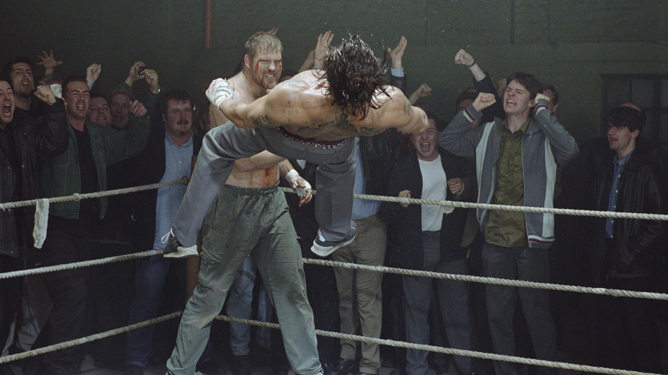 Scott Welch playing Horace 'Good Night' Anderson in movie Snatch, punching Brad Pitt's character Mickey off the ground in this famous fight scene.