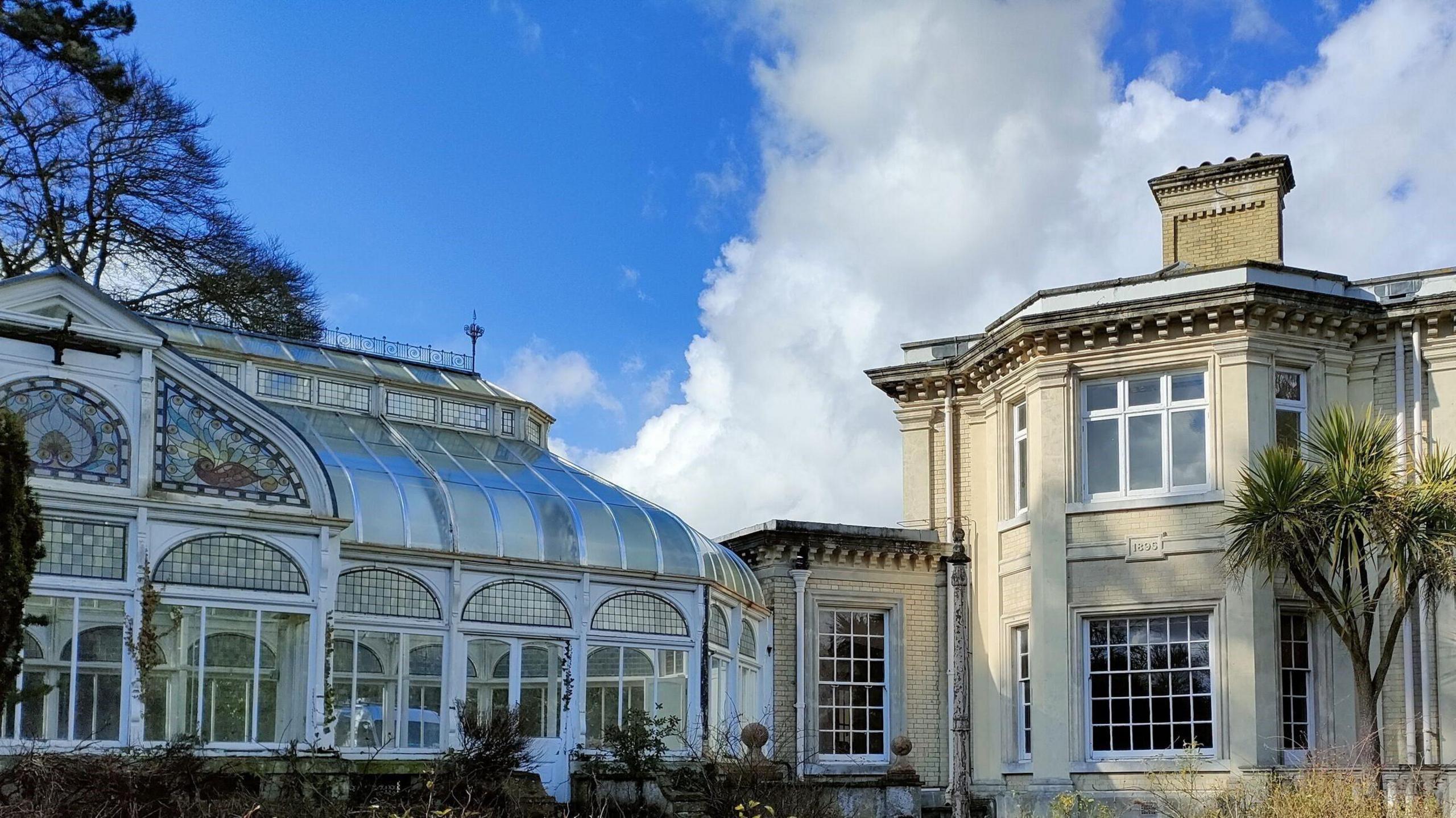 A wide shot of the building, including the conservatory