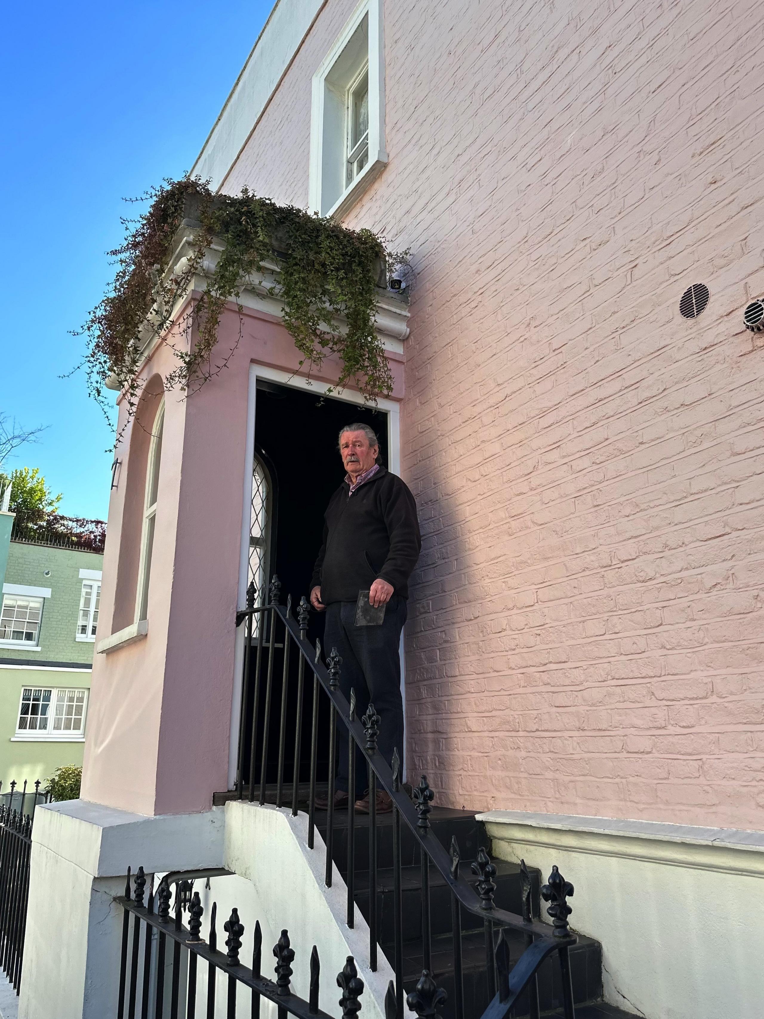 Peter Lee outside his home