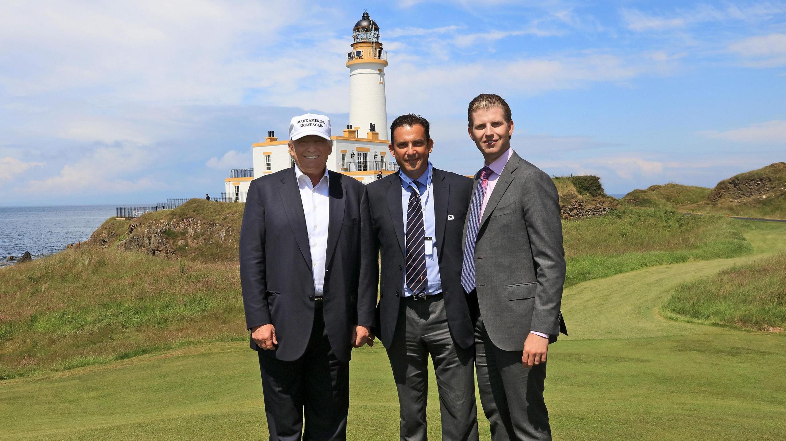Donald Trump with golf course architect Martin Ebert of England (centre) and his son Eric Trump (right) during the re-opening of the Ailsa Course