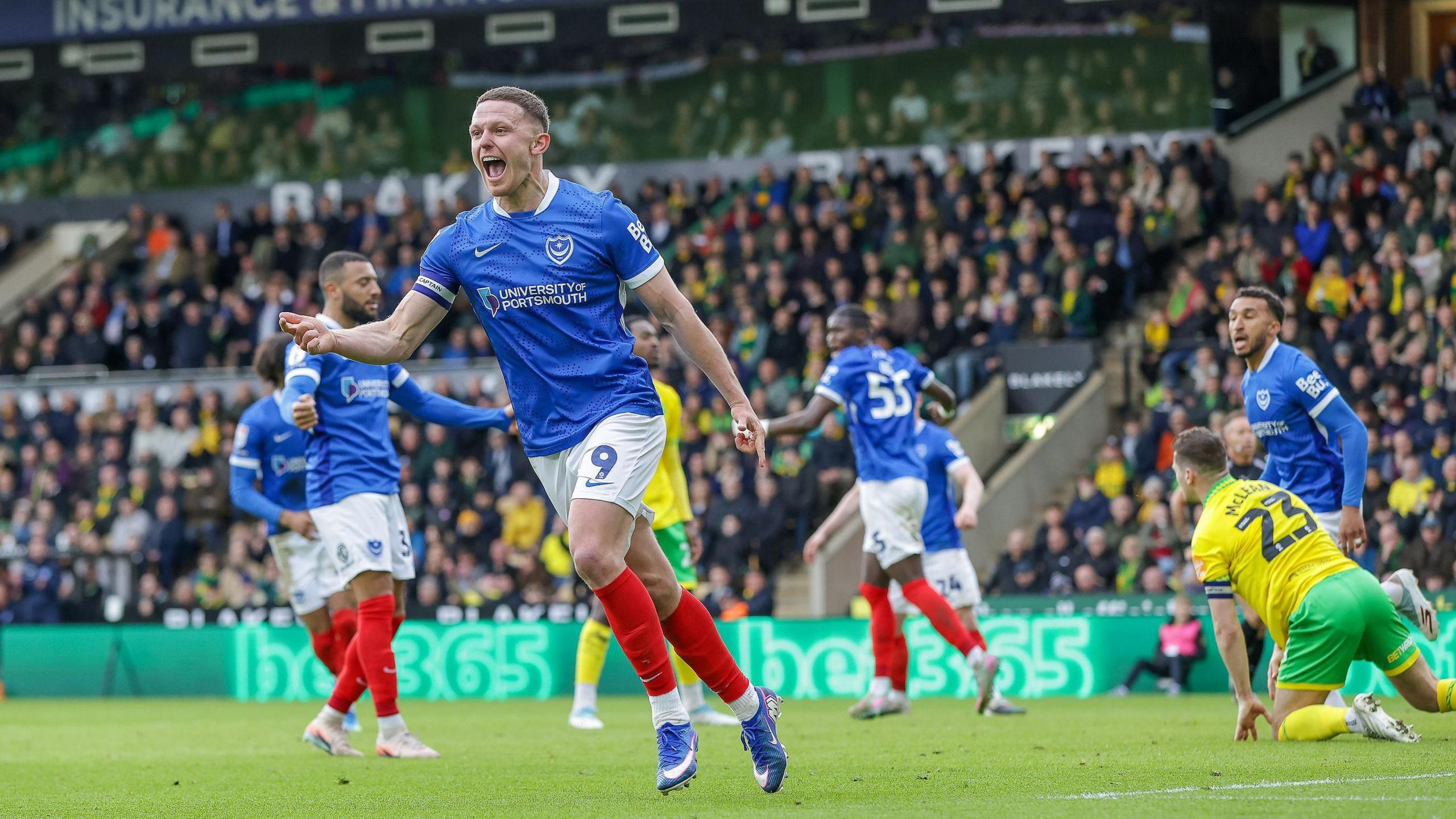 Colby Bishop and the Portsmouth players celebrate after Pelle Mattsson's own goal