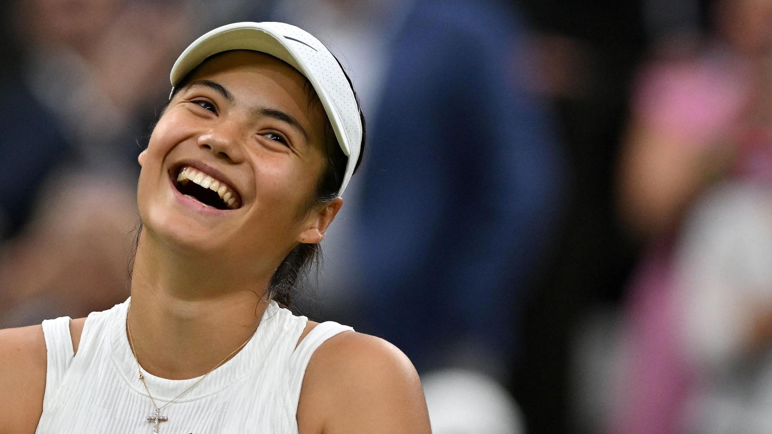 Emma Raducanu laughs after beating Maria Sakkari in the Wimbledon third round