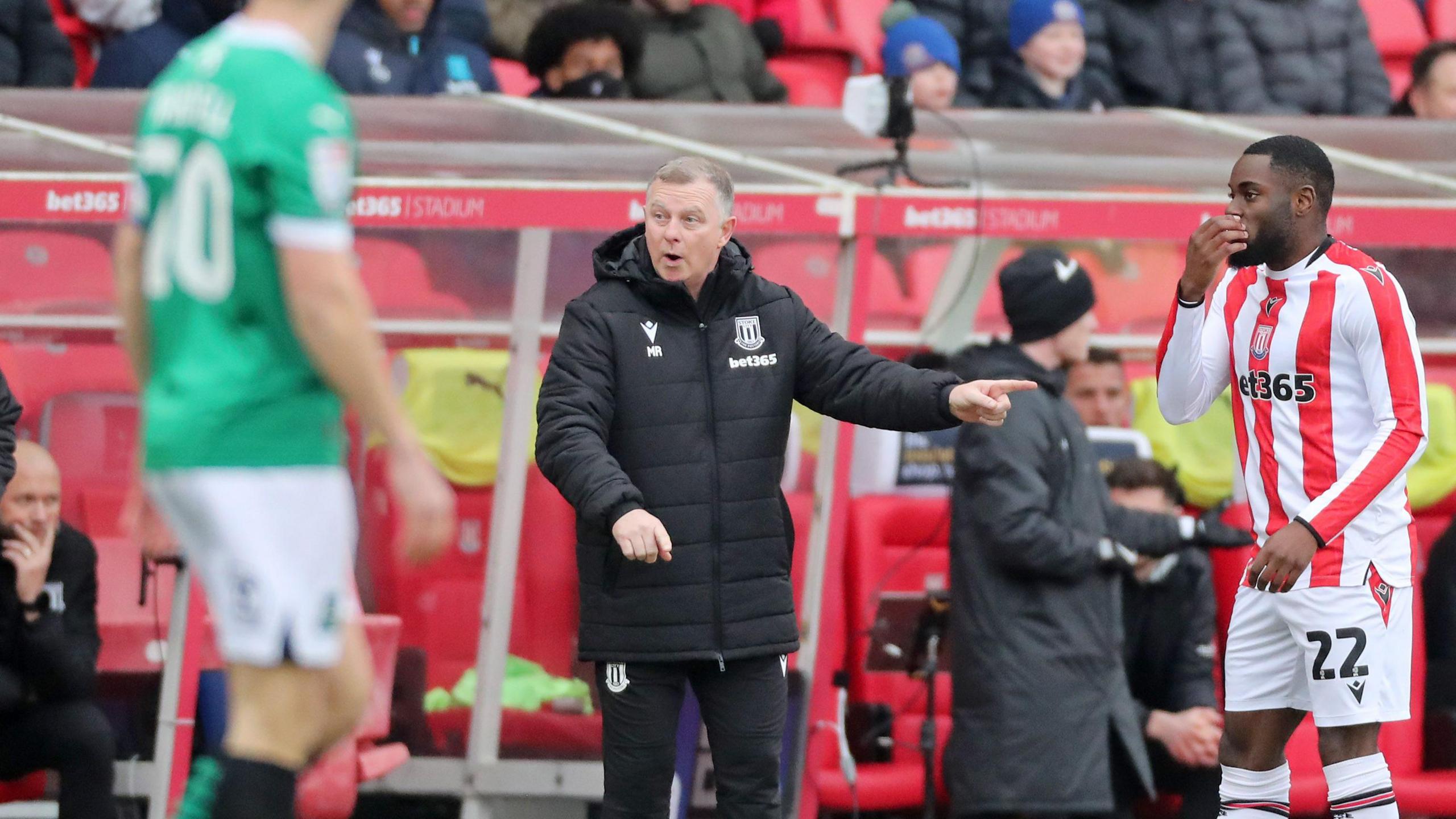 Mark Robins directs operations at the Bet 365 Stadium for the first time as Stoke City boss against Plymouth Argyle