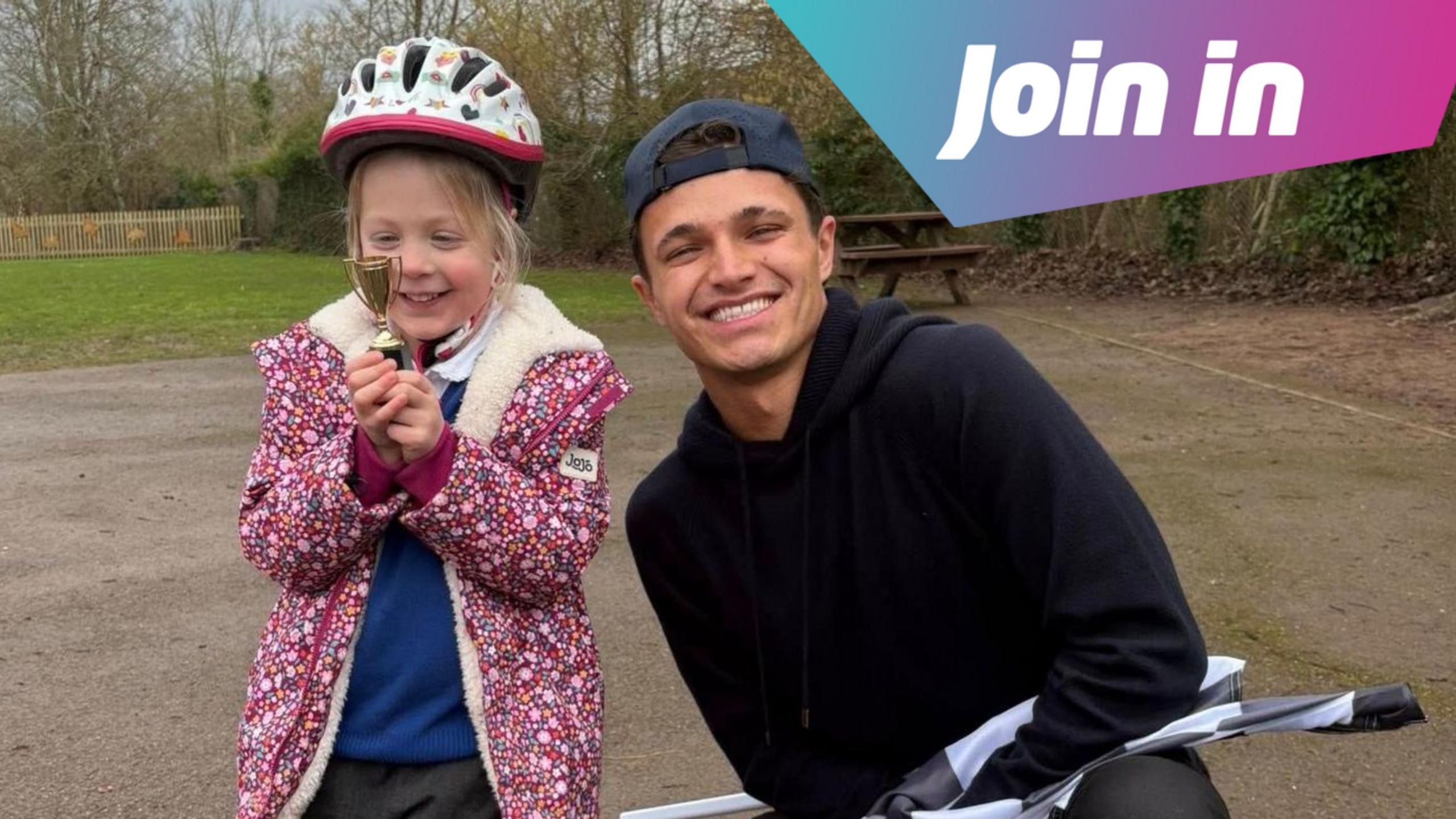 Lando Norris with one of the scooter race winners