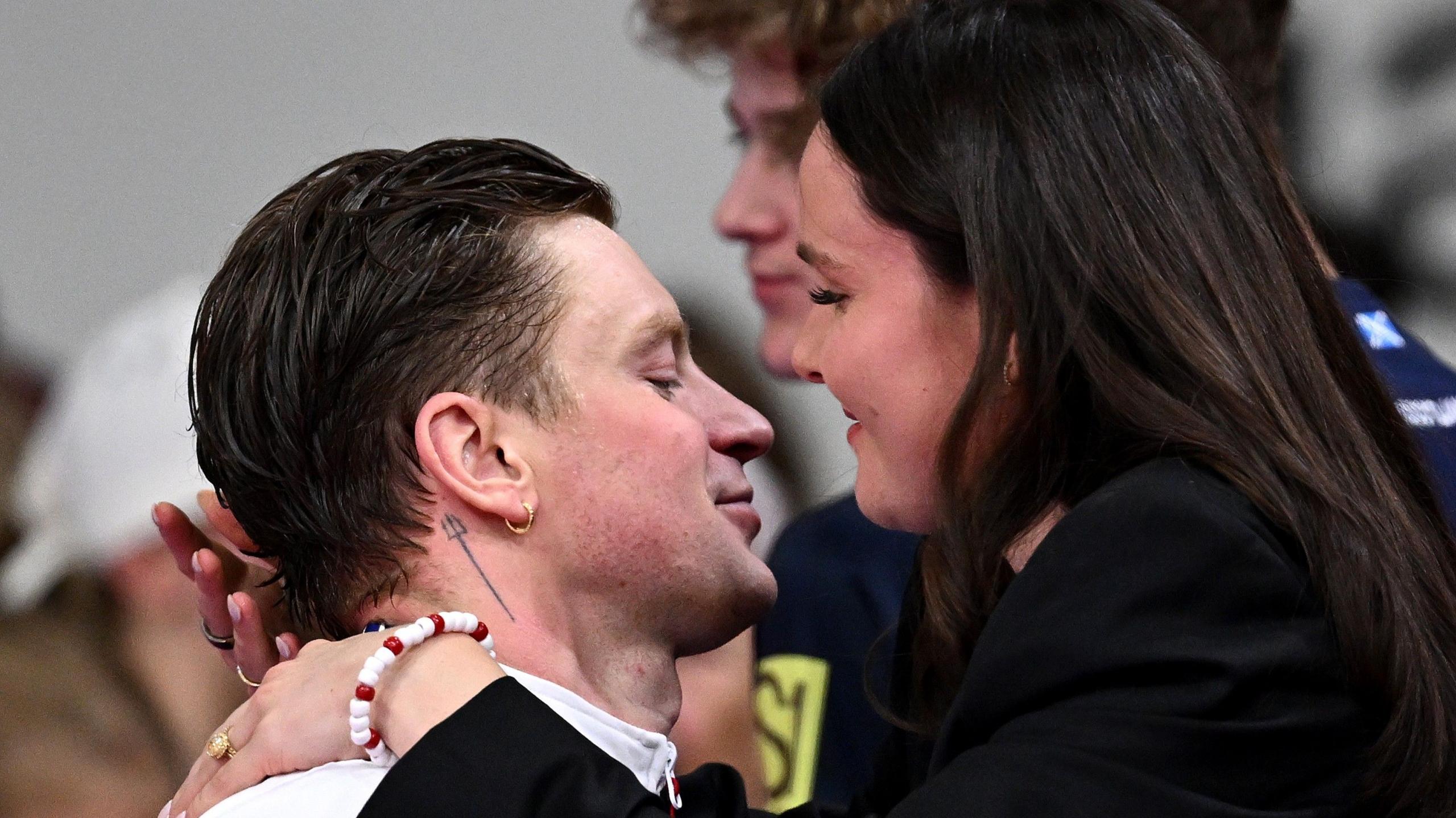 Adam Ramsay-Peaty embraces wife Holly at Tollcross Swimming Centre