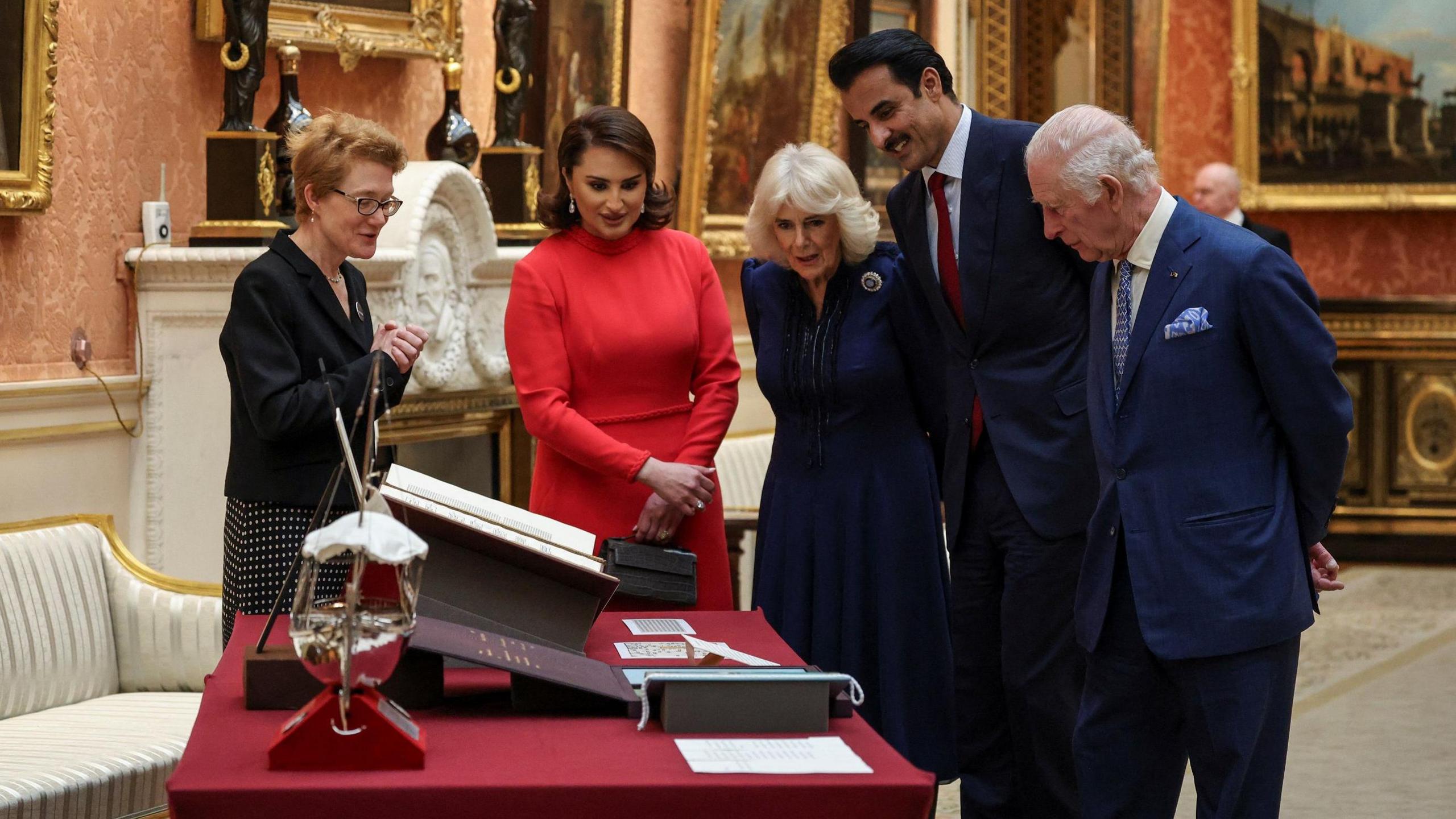 (Right to left) King Charles, Qatari Emir Sheikh Tamim bin Hamad Al Thani,  Queen Camilla, and the Qatari Emir's wife Sheikha Jawaher bint Hamad bin Suhaim Al Thani view a displays of Qatari items from the Royal Collection and Turquoise Mountain.