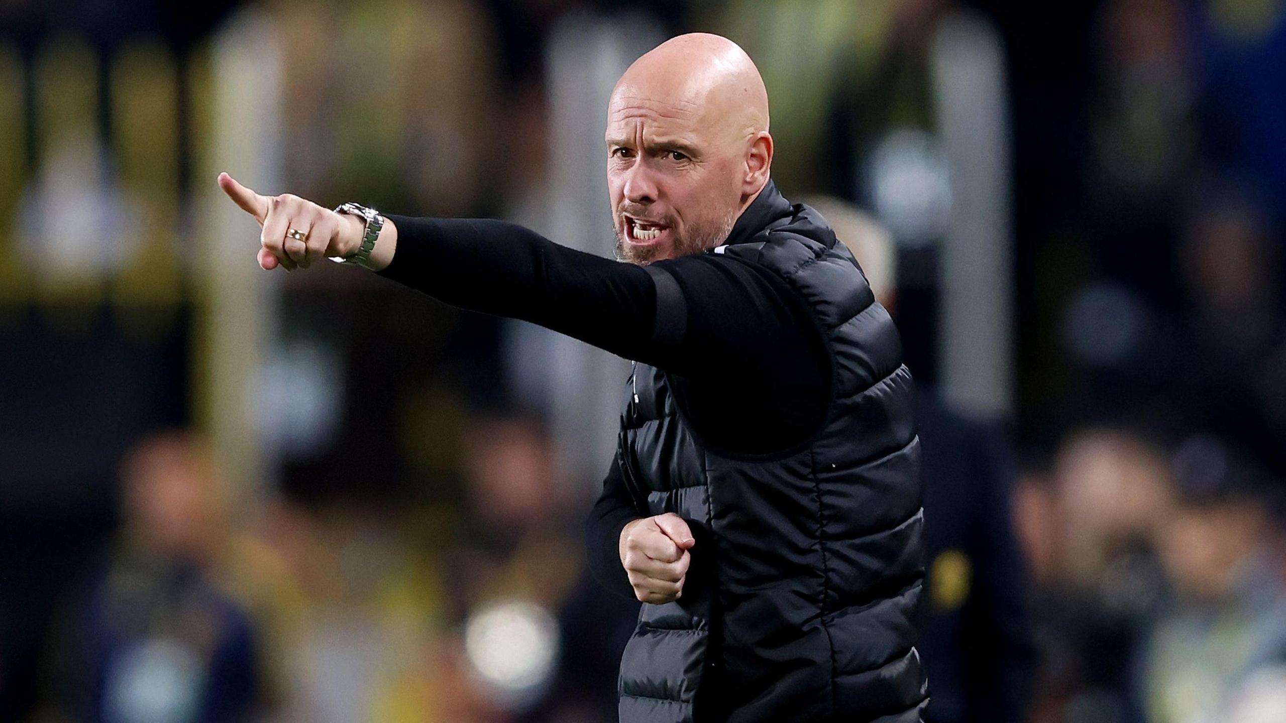 Erik ten Hag gestures during match