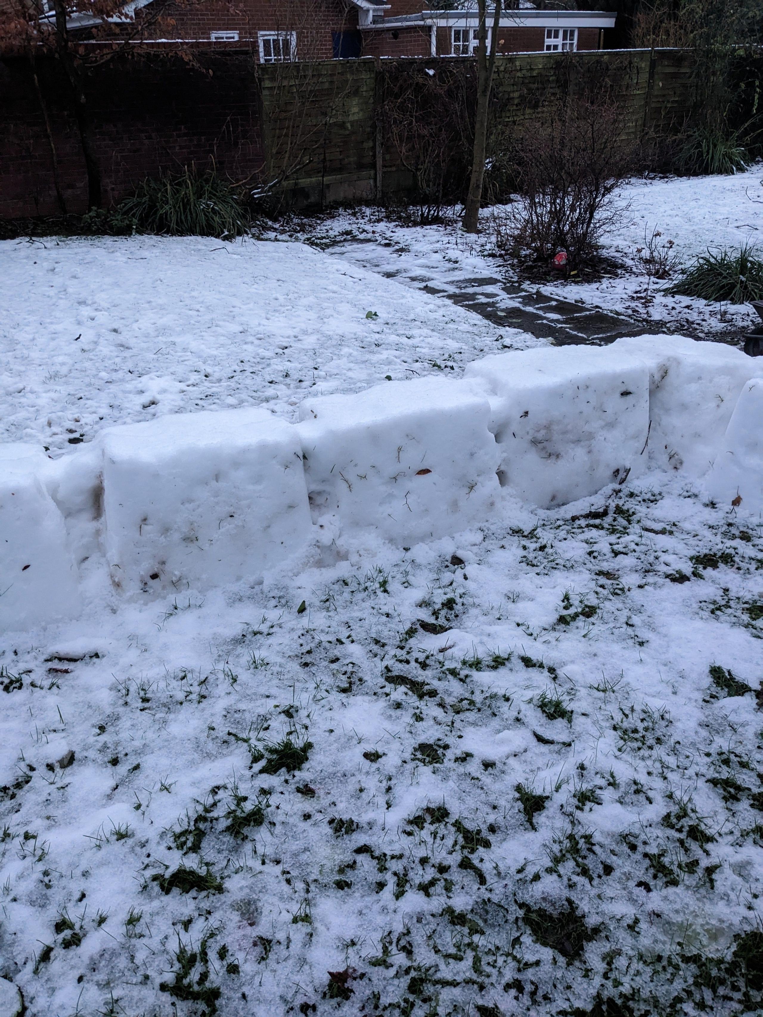 Happy Axolotl started engineering this sturdy-looking snow fort before running out of snow.