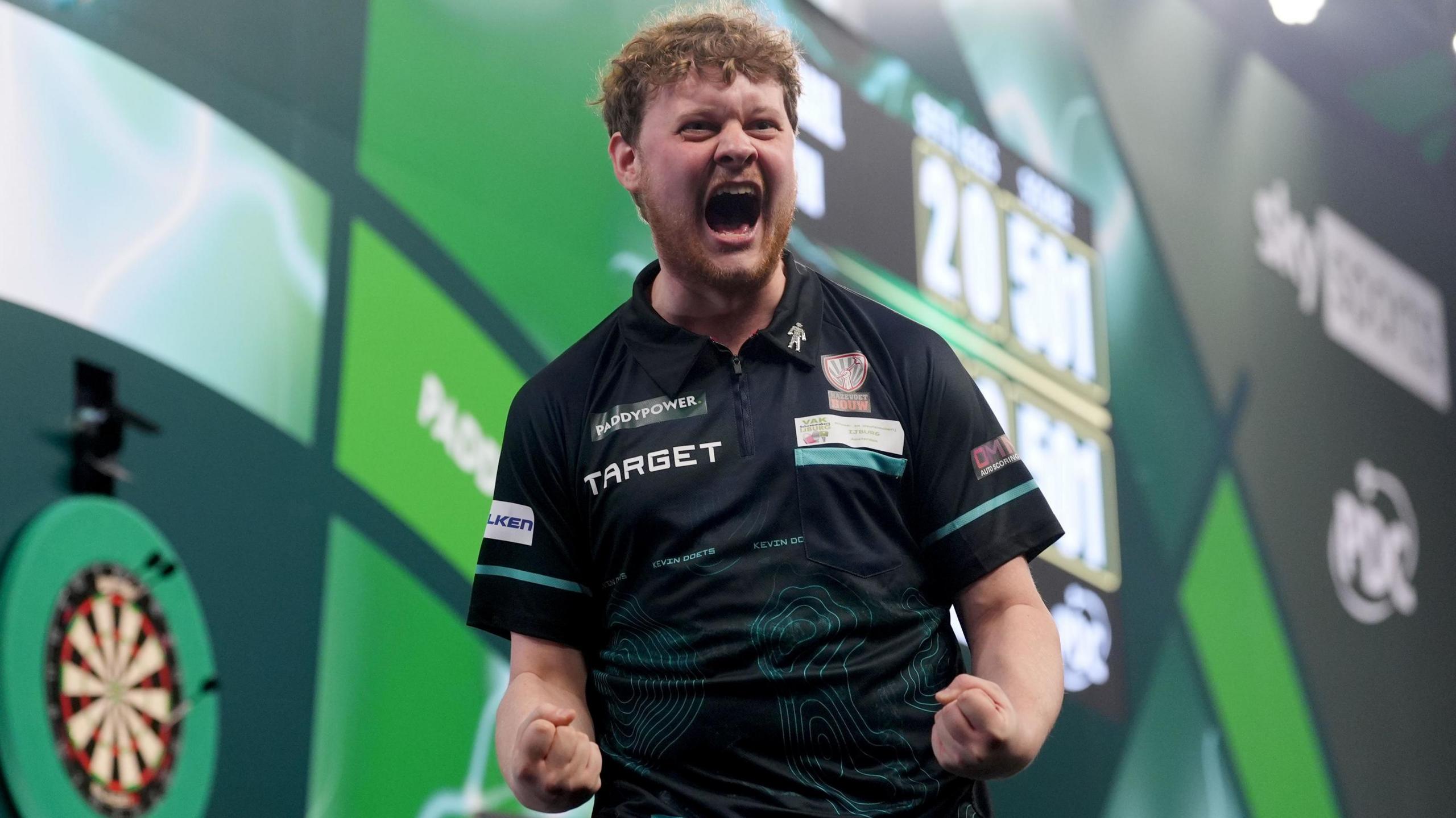 Kevin Doets celebrates victory over  Michael smith