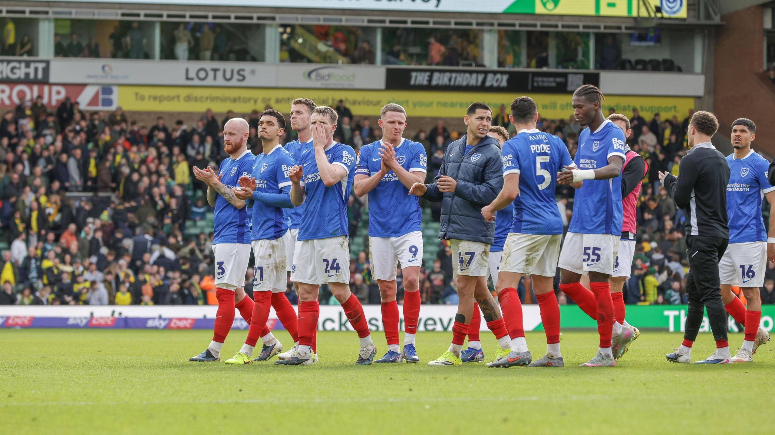 Portsmouth fans applauding their fans at Carrow Road