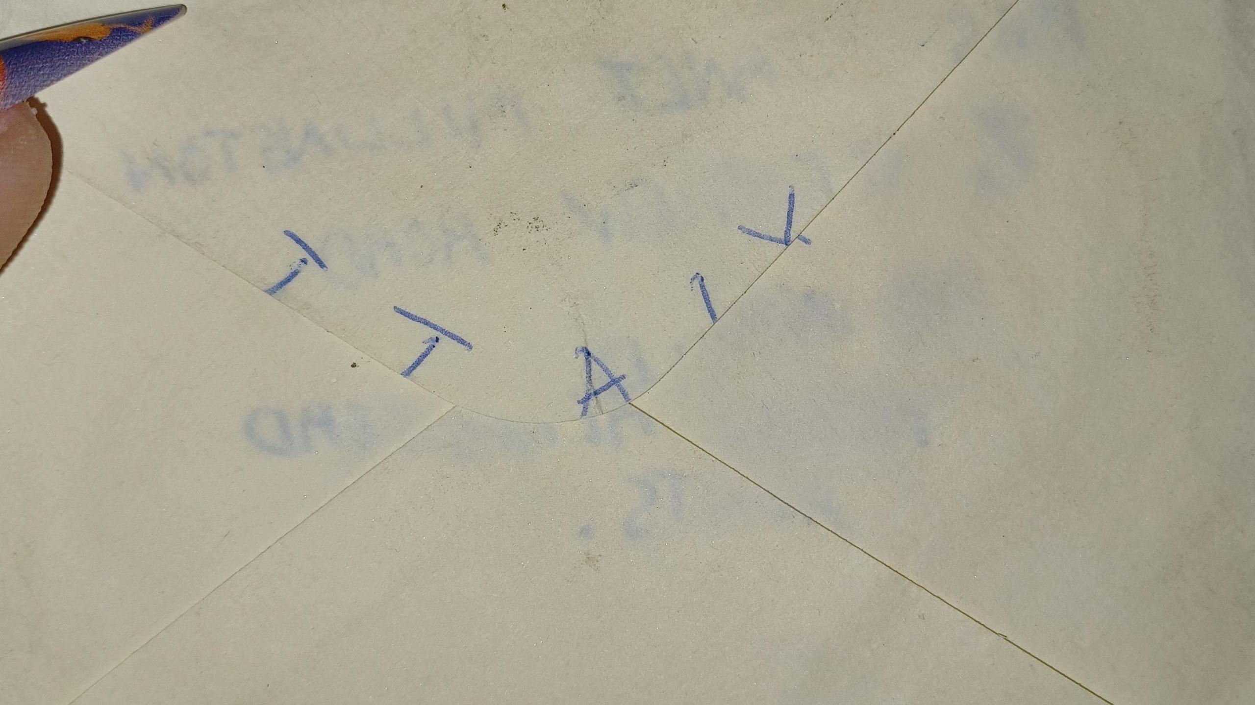 The back of an envelope with the word "ITALY" written in capital letters on it