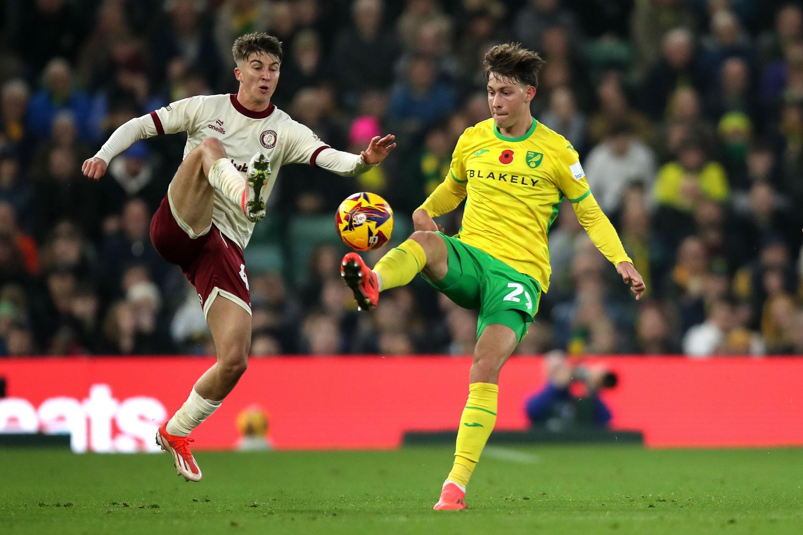 Bristol City player George Earthy has his boot raised during match as he competes for the ball against Norwich City.