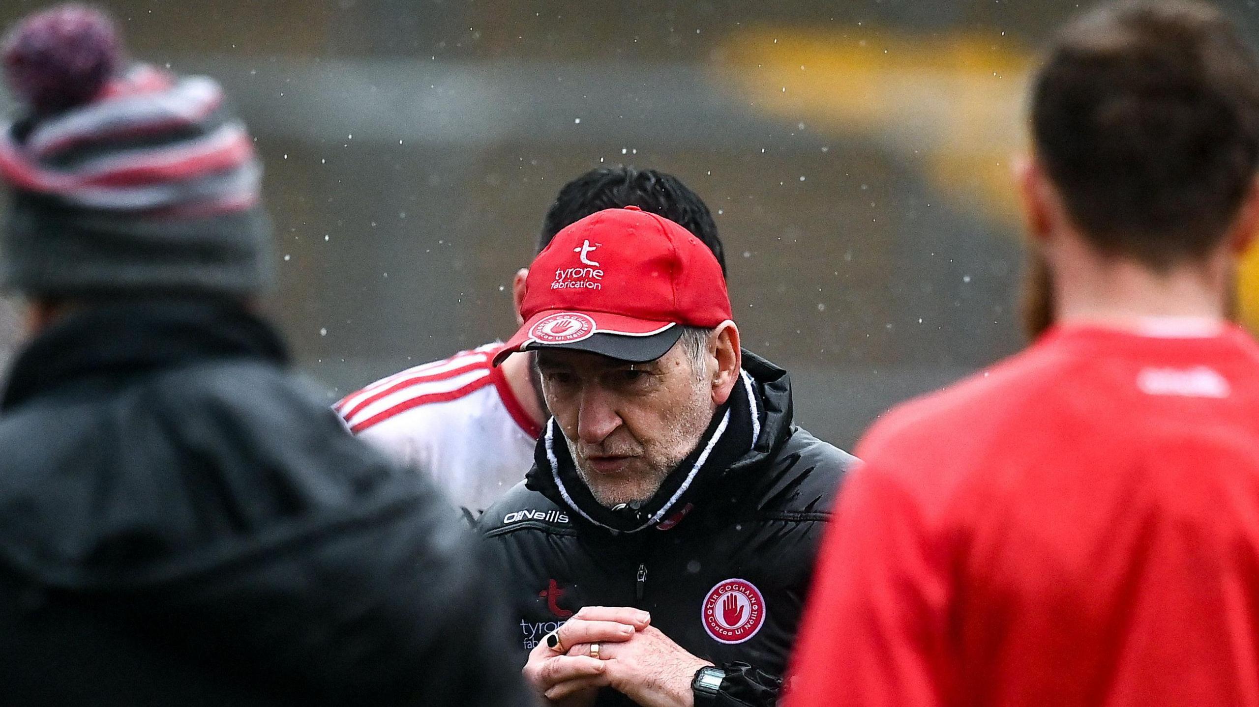 Tyrone manager Mickey Harte speaks to his players following the Ulster GAA Football Senior Championship Quarter-Final match between Donegal and Tyrone