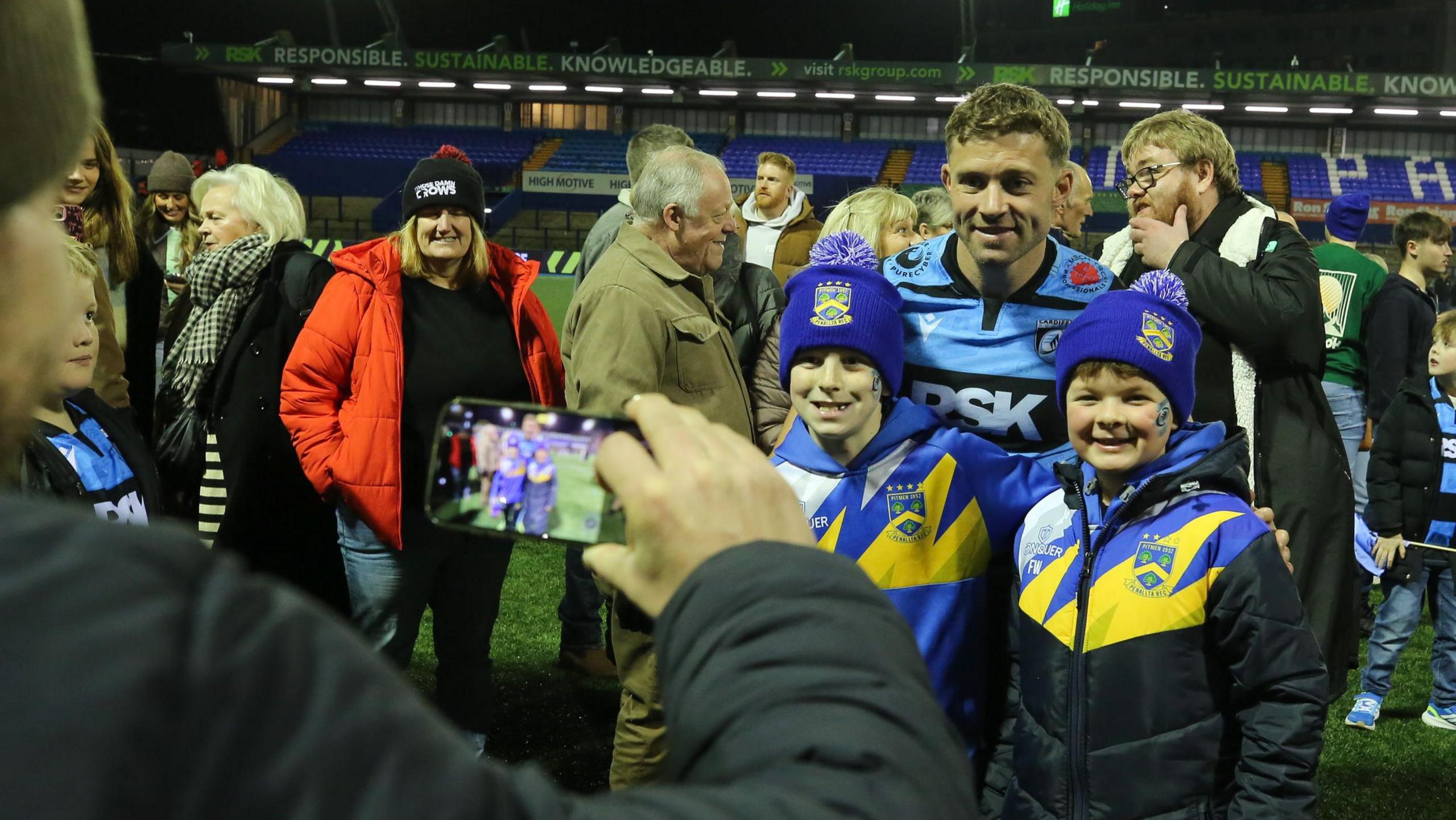 Leigh Halfpenny poses with fans for a picture after Cardiff's win against Ulster