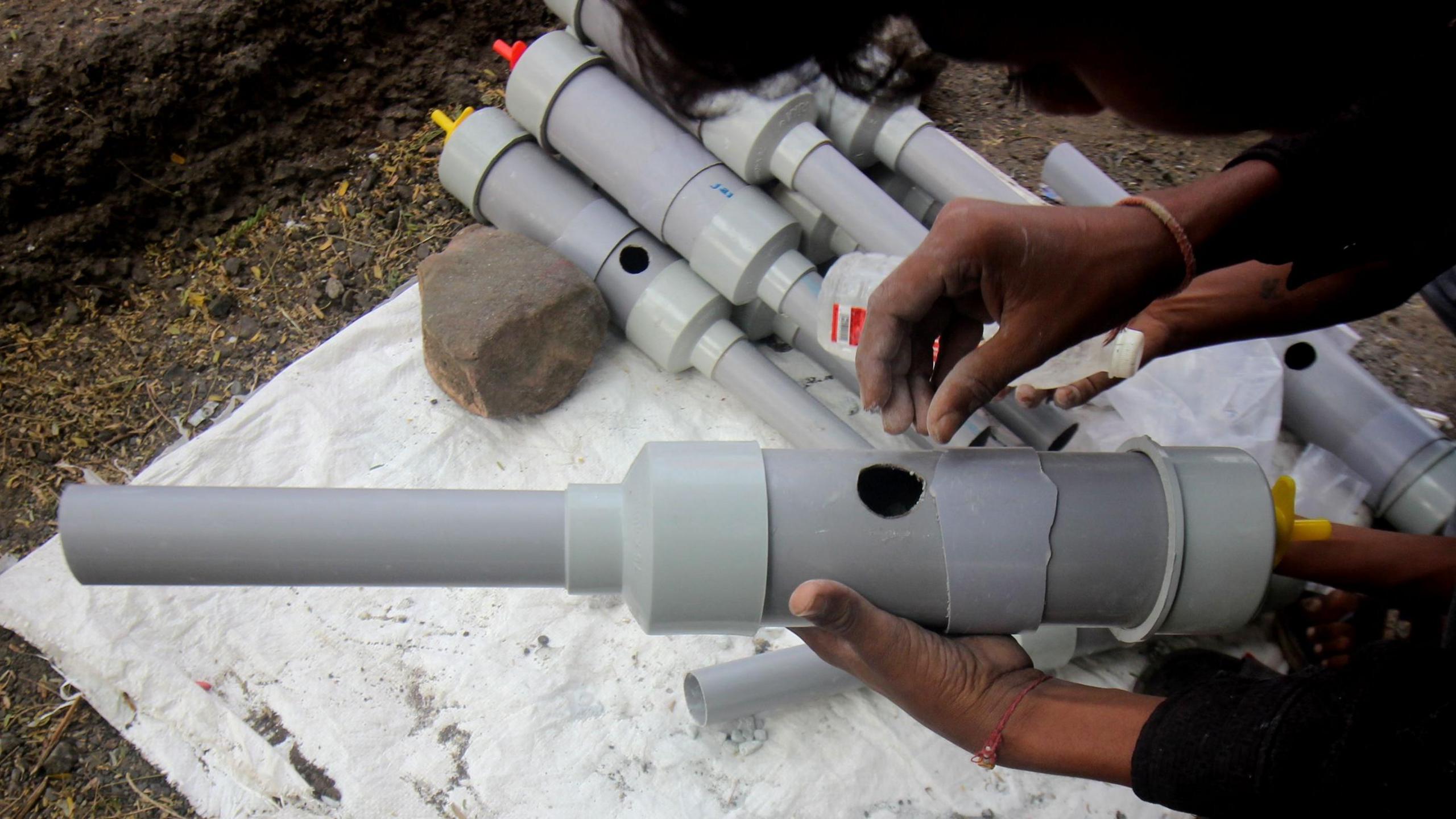 A photo of a boy holding a carbide gun, Bhopal
