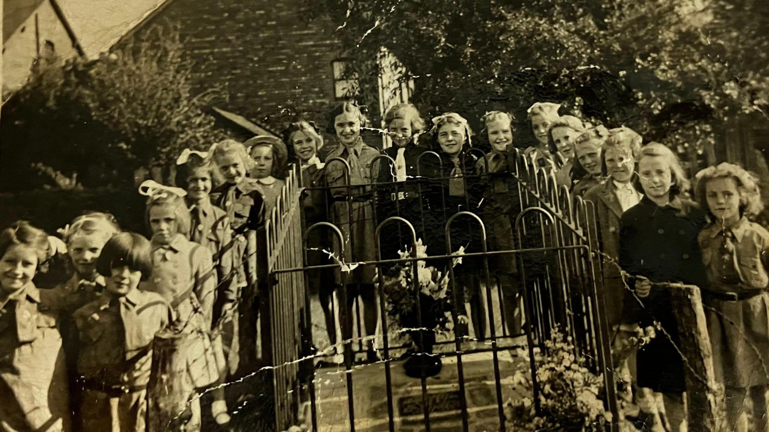 A local Brownie group stand by Lt Arthur Brown's memorial