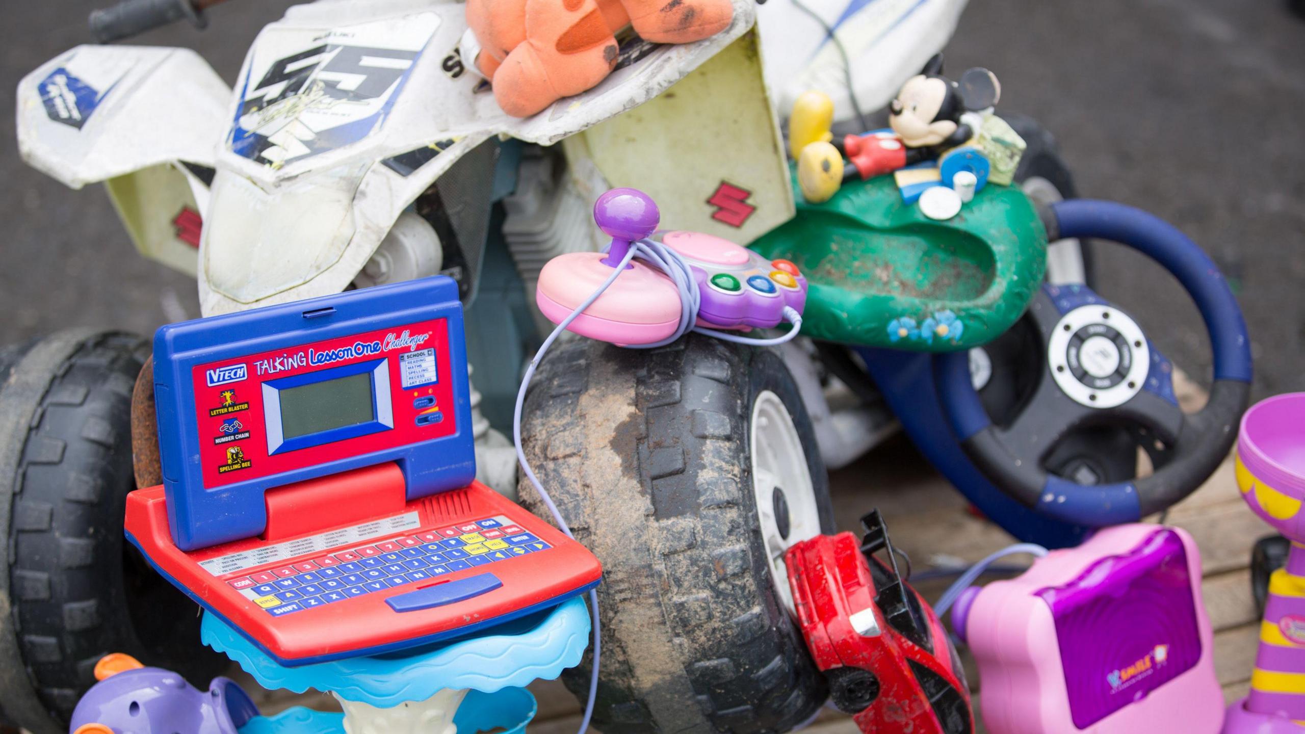 small electronic items and toys that have been thrown away