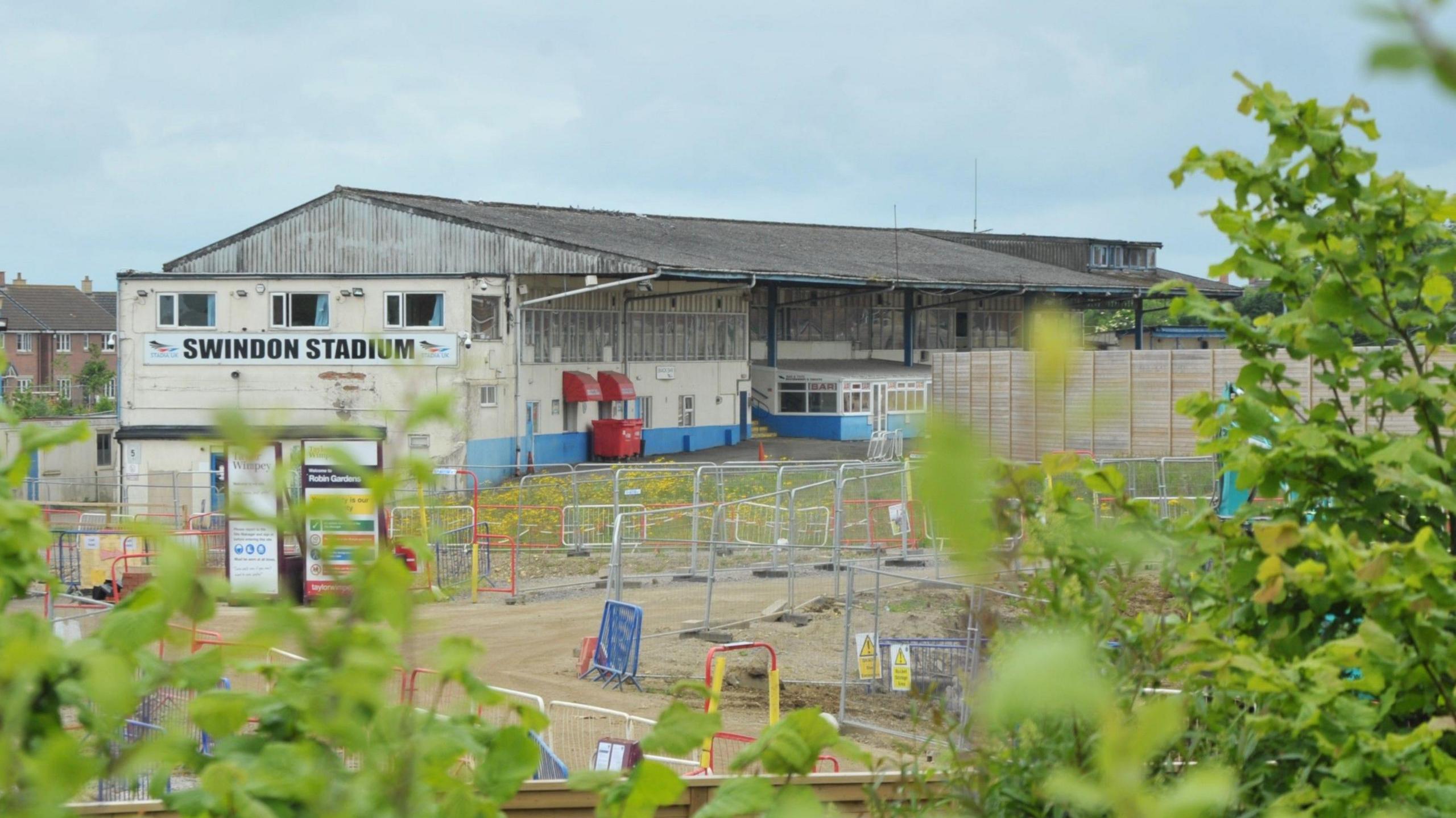 Construction site outside Abbey Stadium. Metal fences can be seen.