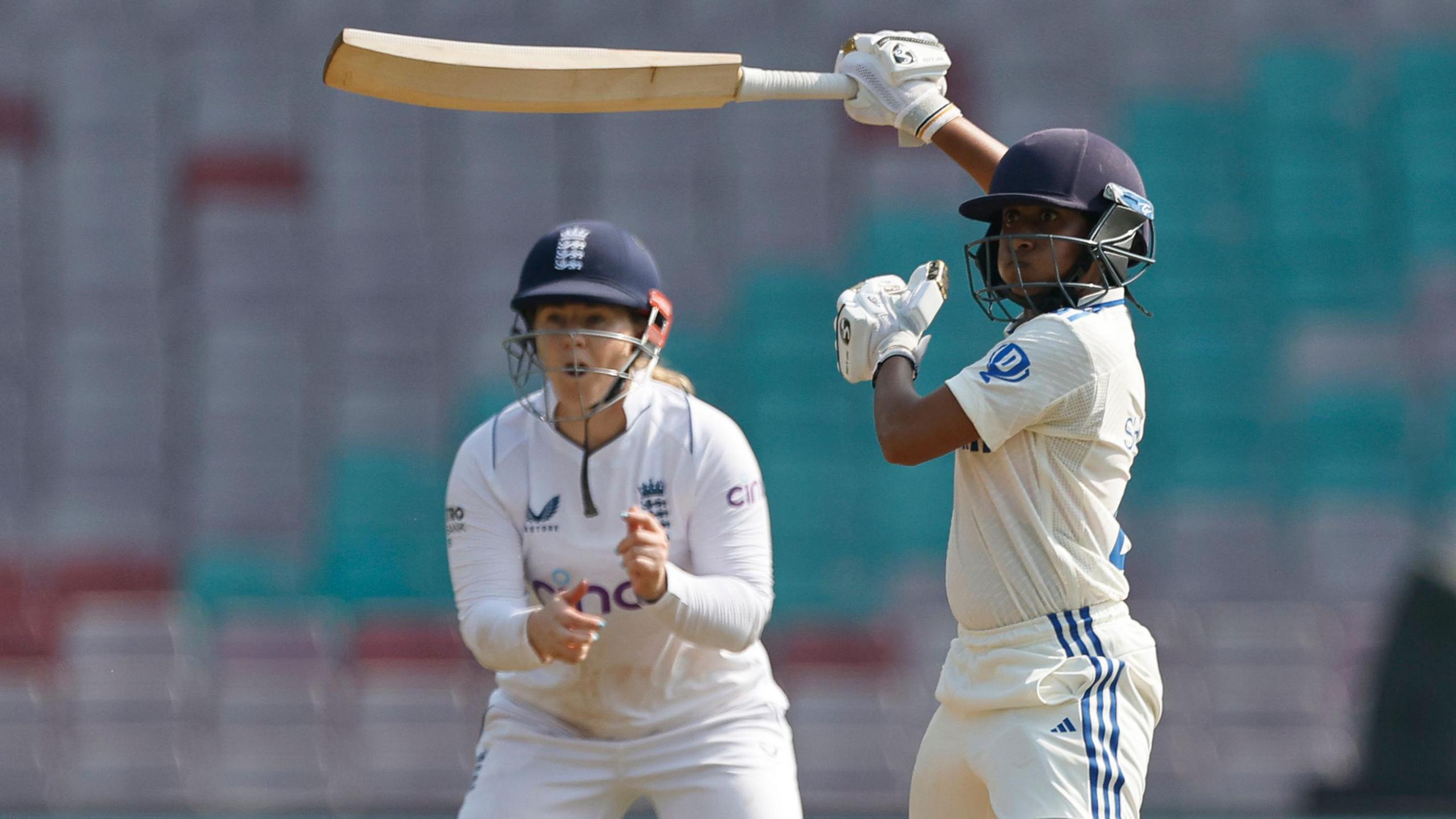 India batter Satheesh Shubha hits out, watched by England fielder Tammy Beaumont, in 2023