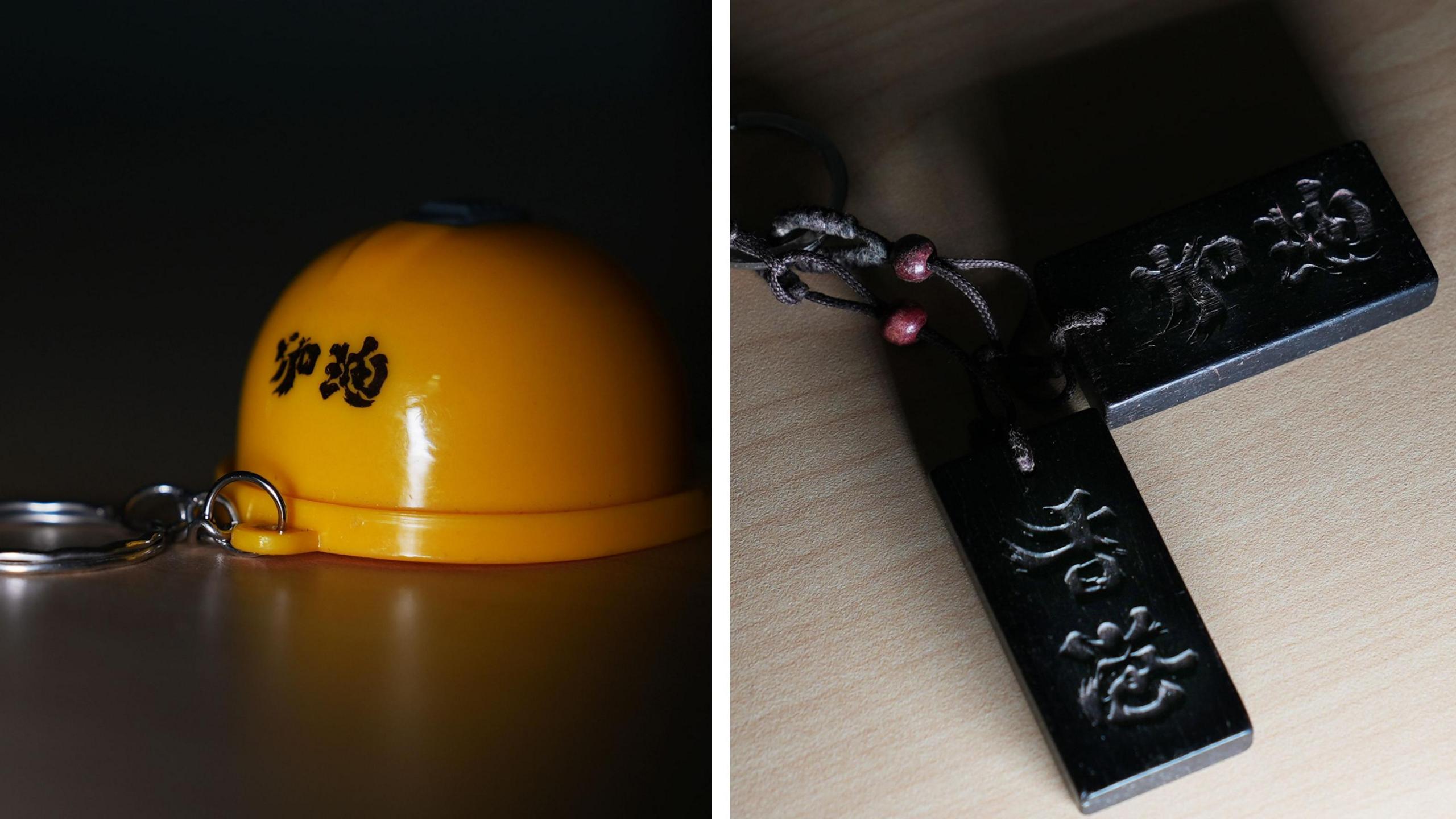 Composite picture of Hong Kong protest memorabilia - a yellow helmet and  a slogan carved in wood. 