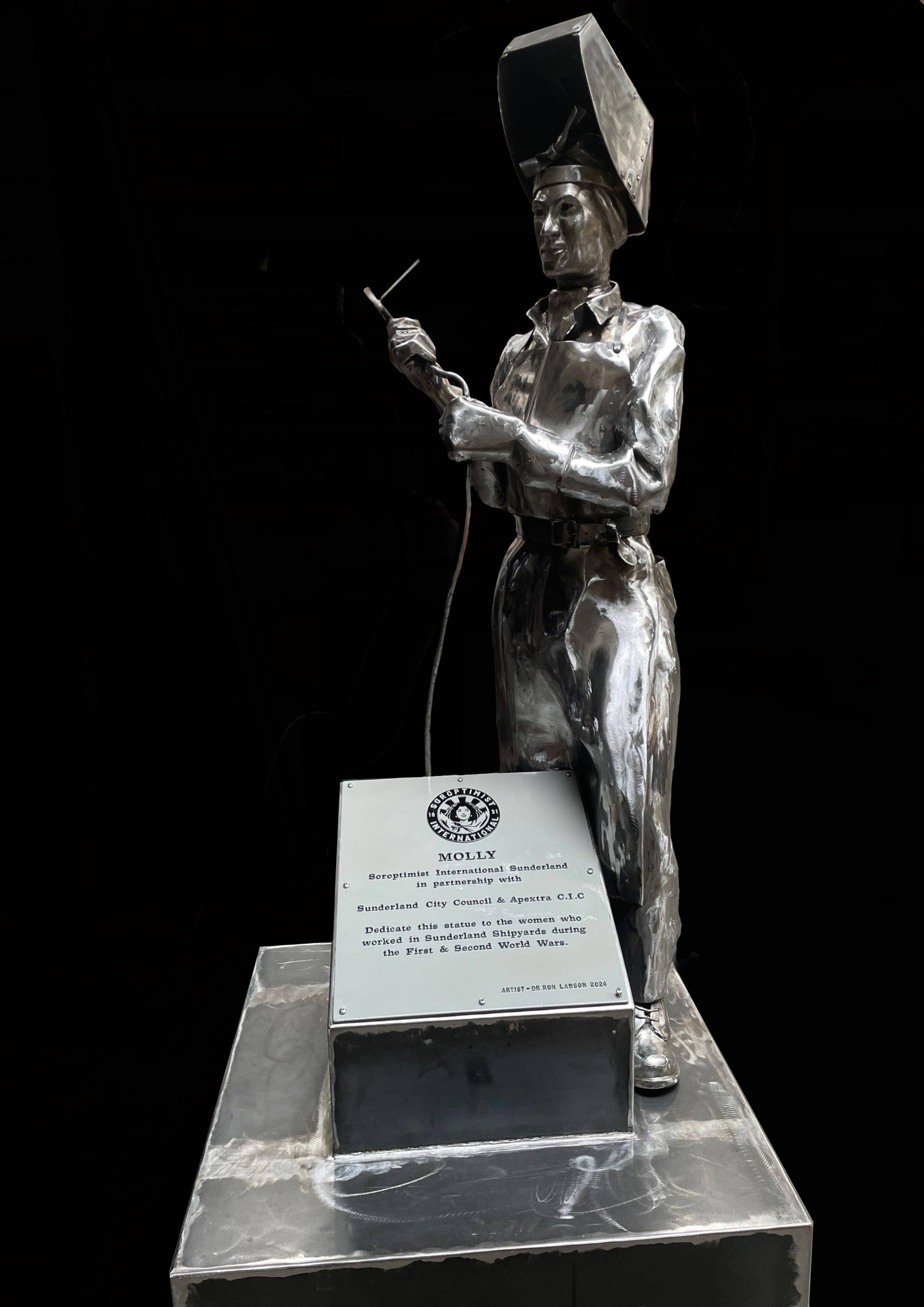 A silver statue shows  female welder standing over a plaque which says "Molly" and has some information about Sunderland's female shipyard workers.