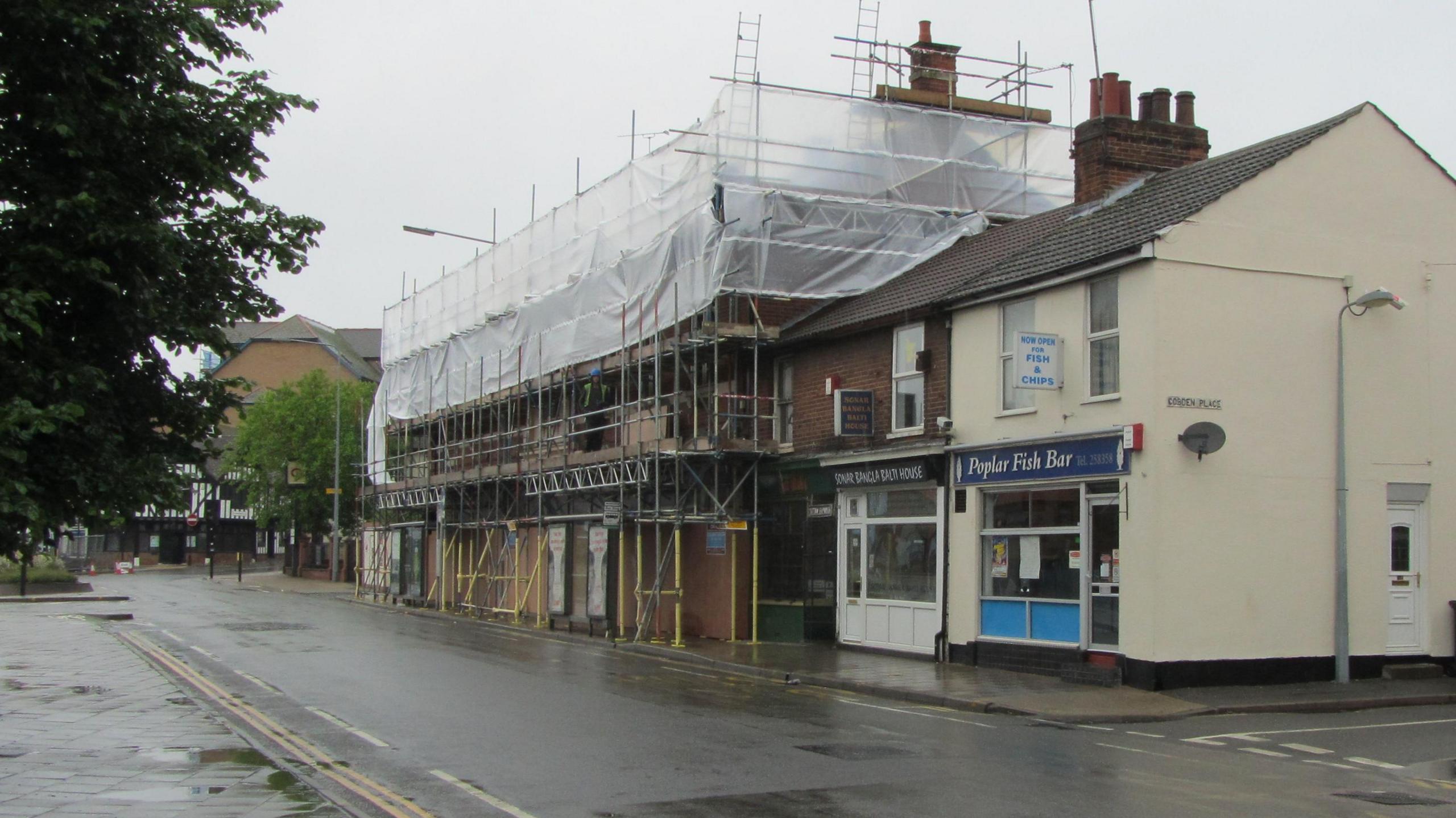 Two buildings on Woodbridge road in Ipswich, the ICA club is surrounded by scaffolding.