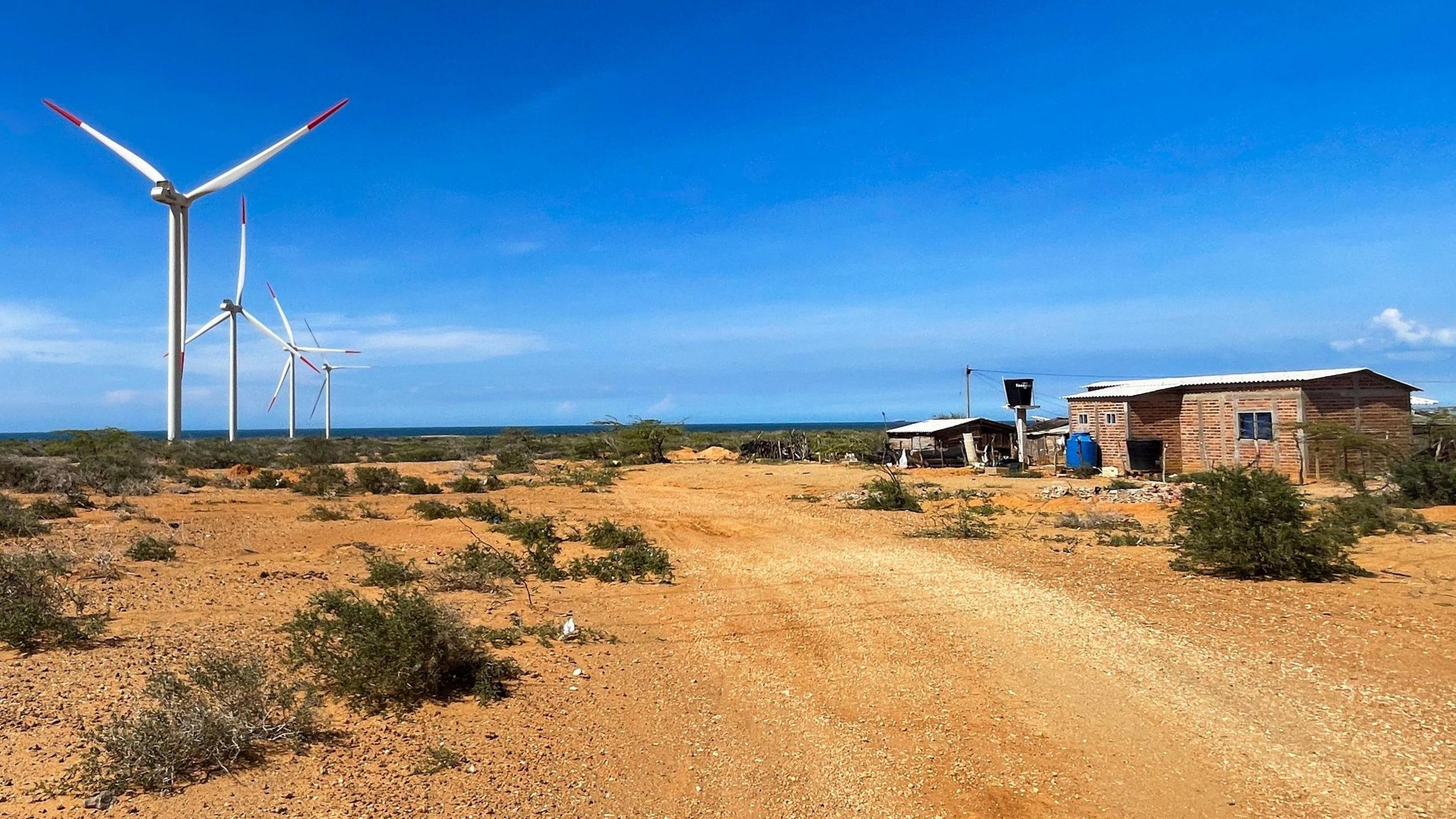 José Luis Iguarán's home on the right, and the wind farm on the left, very close to his house