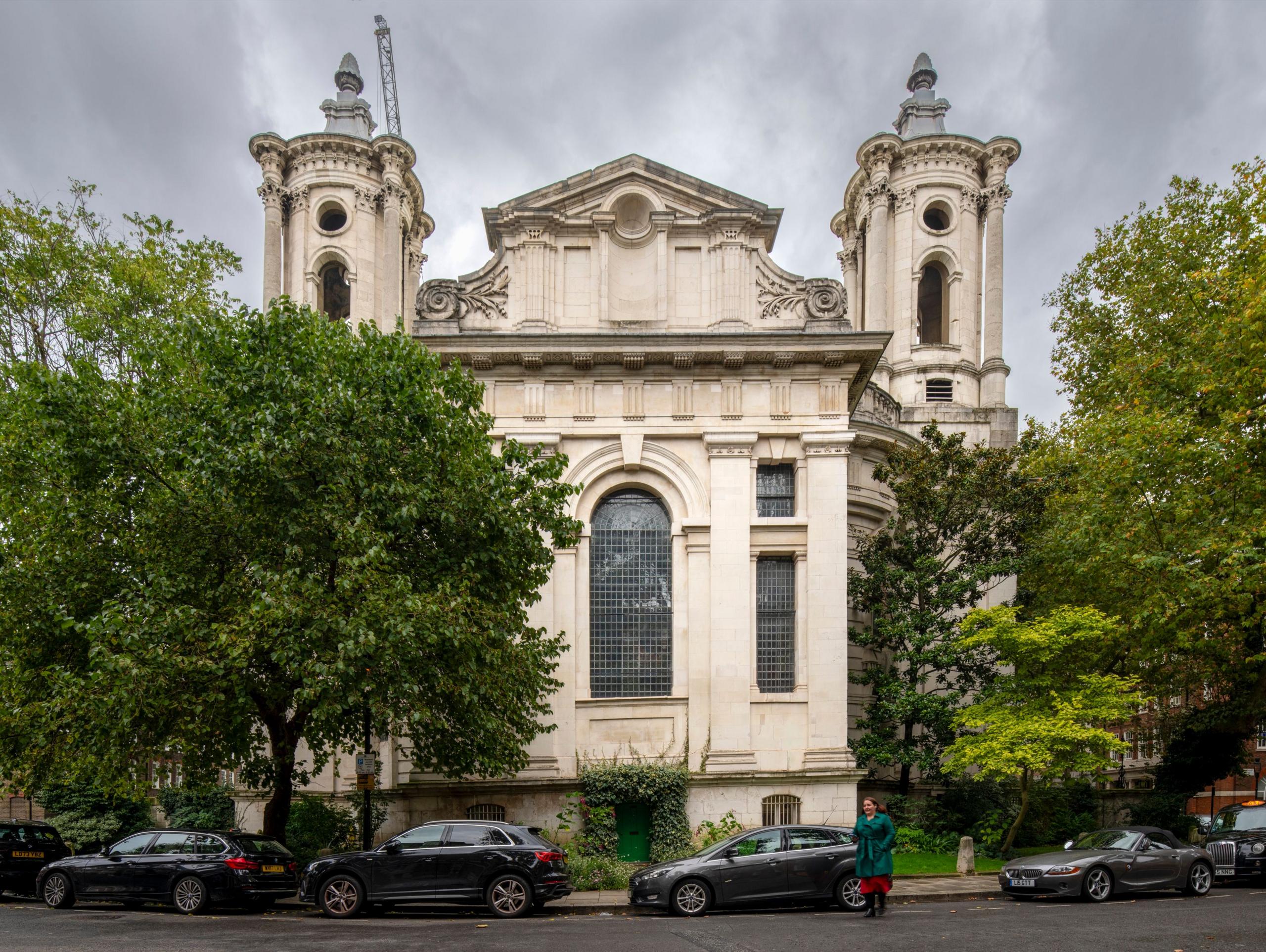 Smith Square Hall with trees and cars parked outside under grey skies