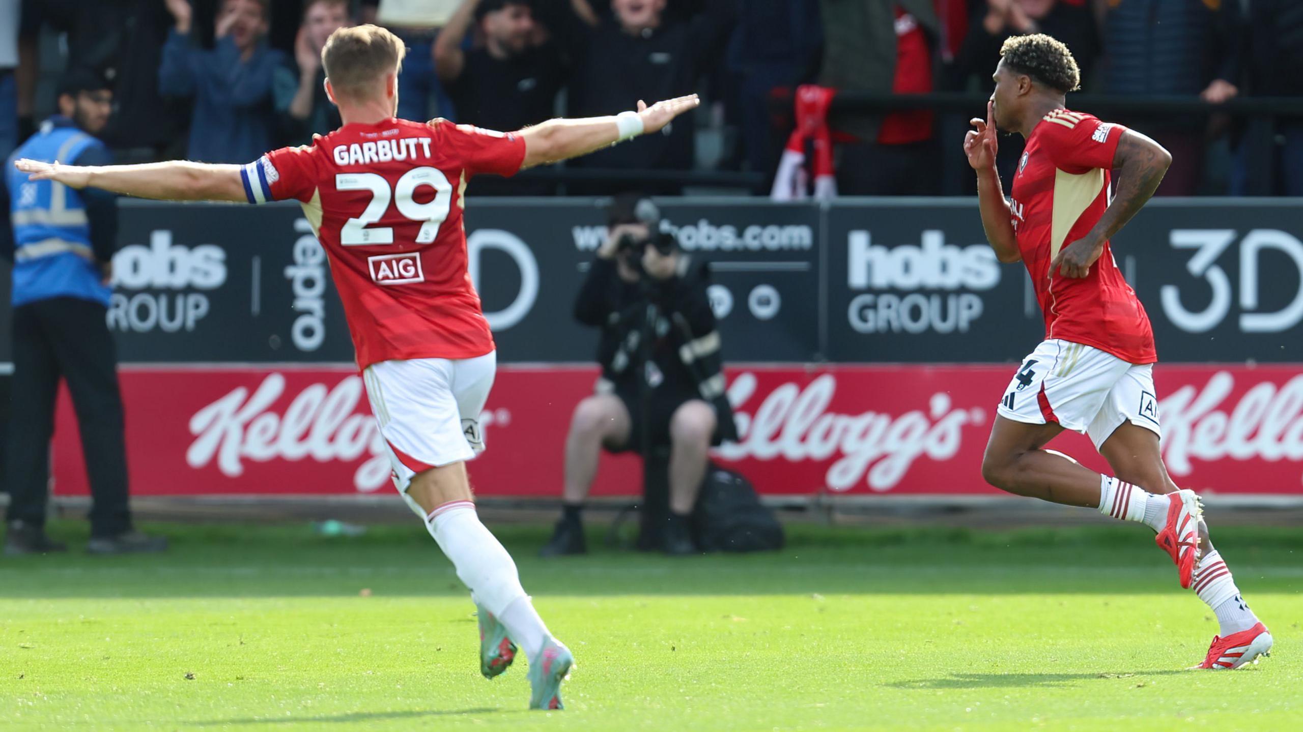 Ossama Ashley (right), of Salford City, celebrates their goal to make it 3-1