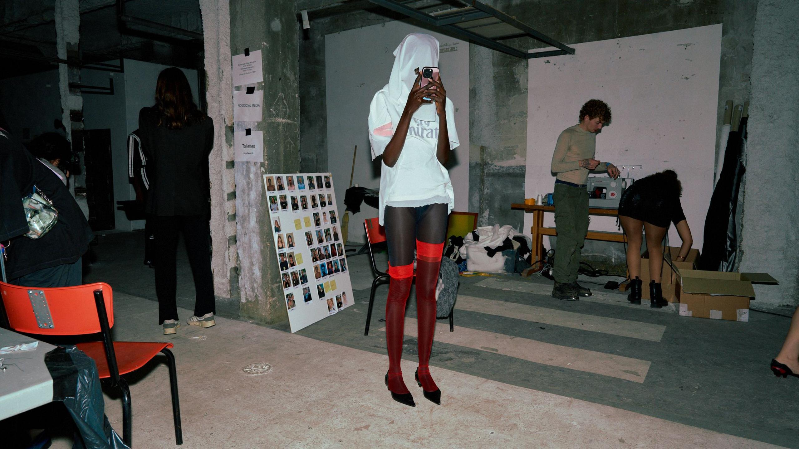 Models backstage at the Prototypes show adapt to their face coverings