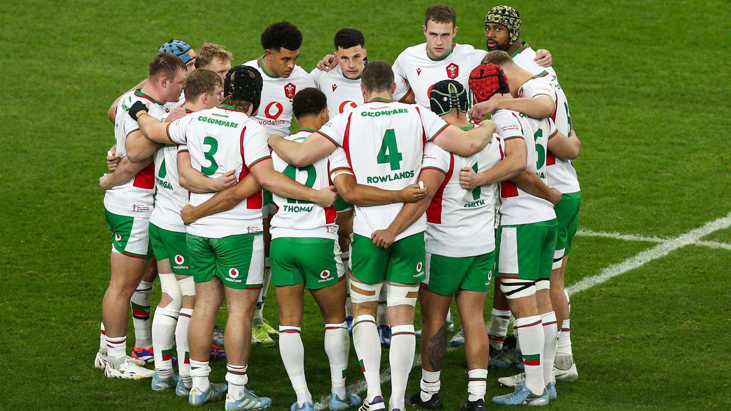 Wales players in a huddle against South Africa