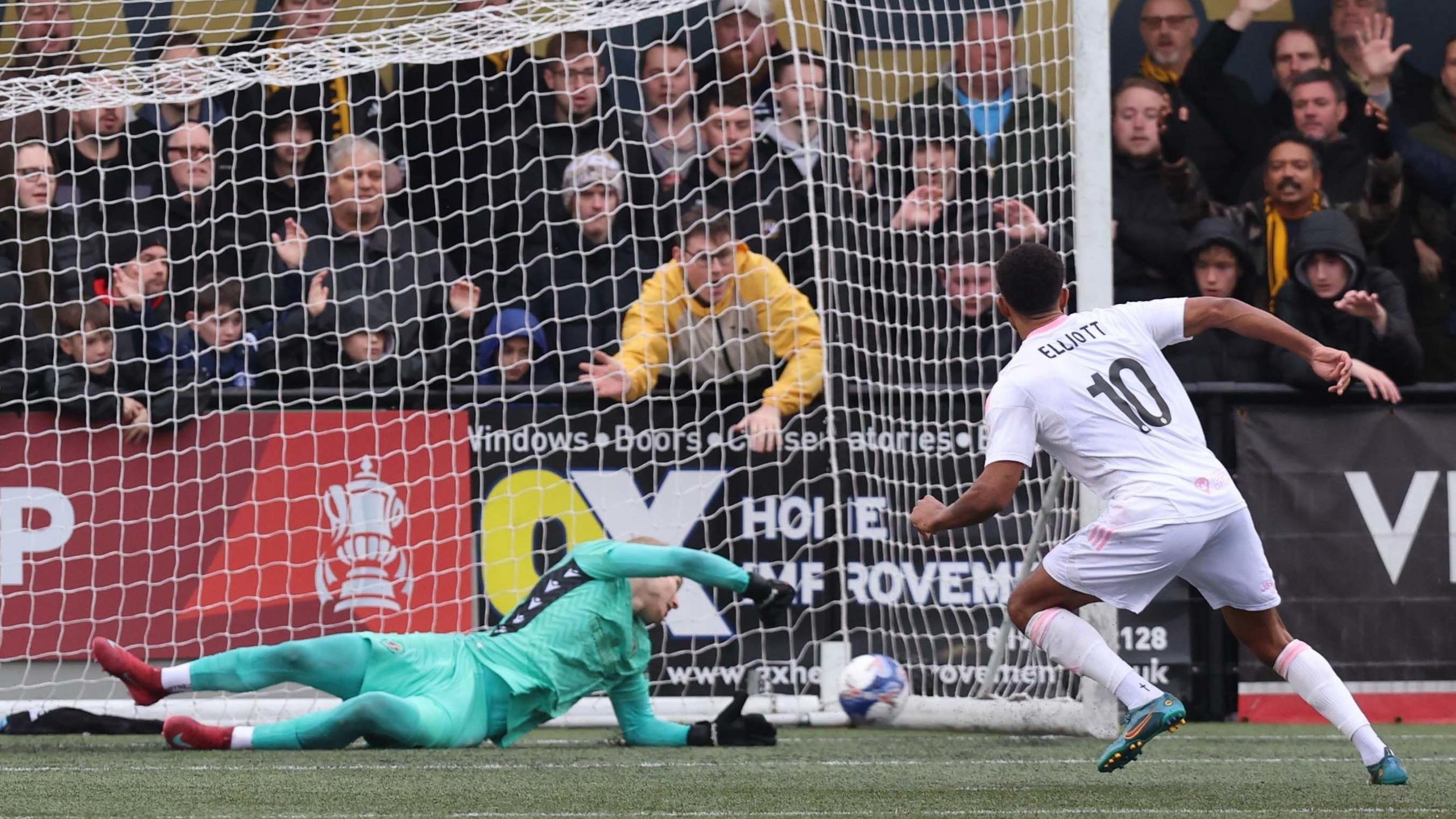 Elliott scores from the penalty spot to open the scoring during the Emirates FA Cup second round match at Arbour Park