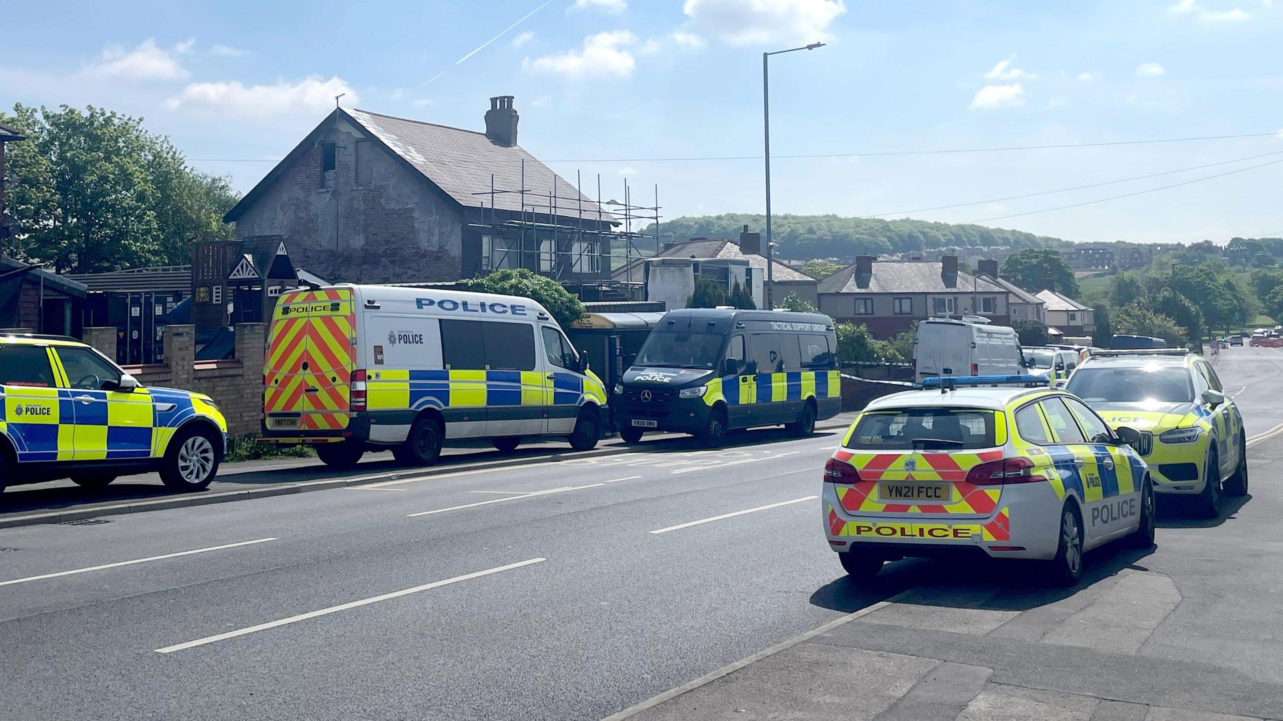 Police cars outside a house