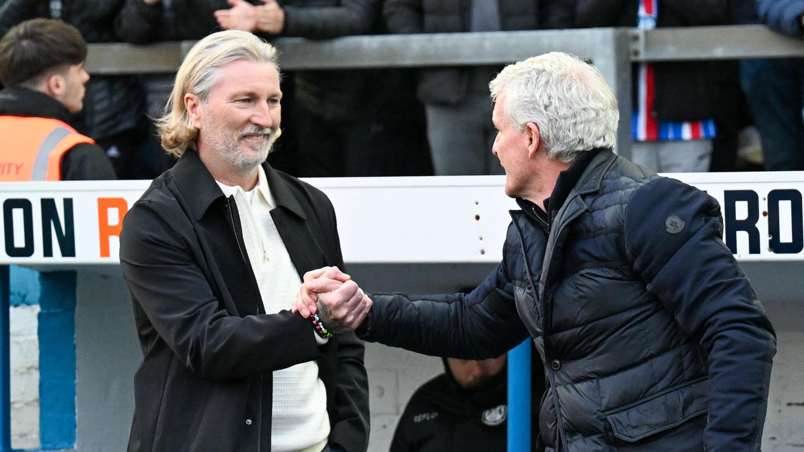Robbie Savage (left) greets Mark Hughes pinch a handshake erstwhile Forest Green went up to Carlisle successful November