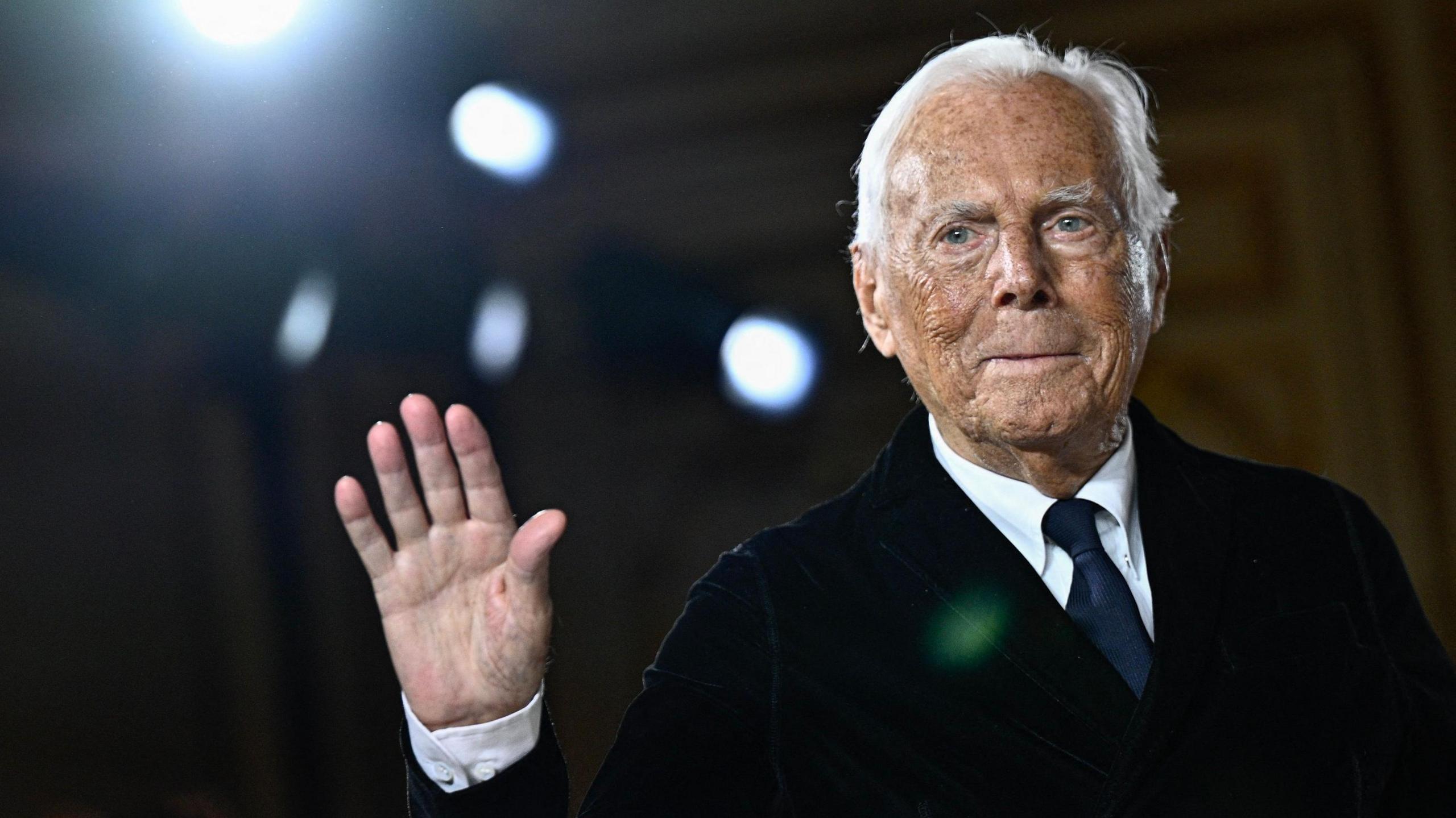 Giorgio Armani waving