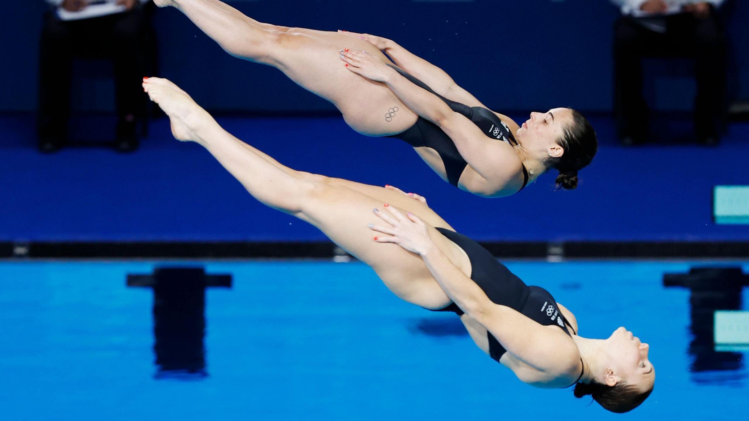 Team GB synchronised springboard female team mid-air 