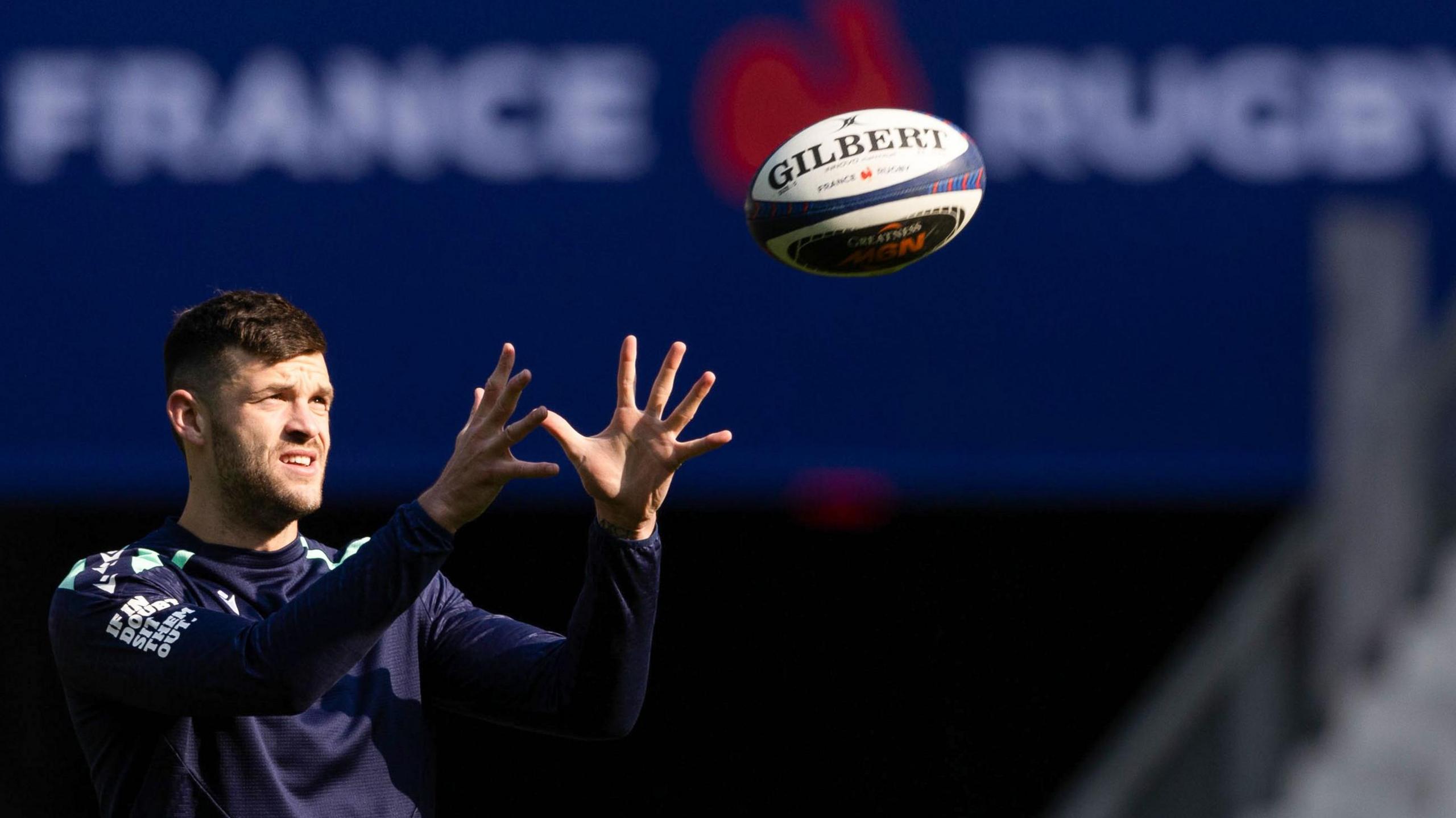 Scotland full-back Blair Kinghorn prepares to catch the ball