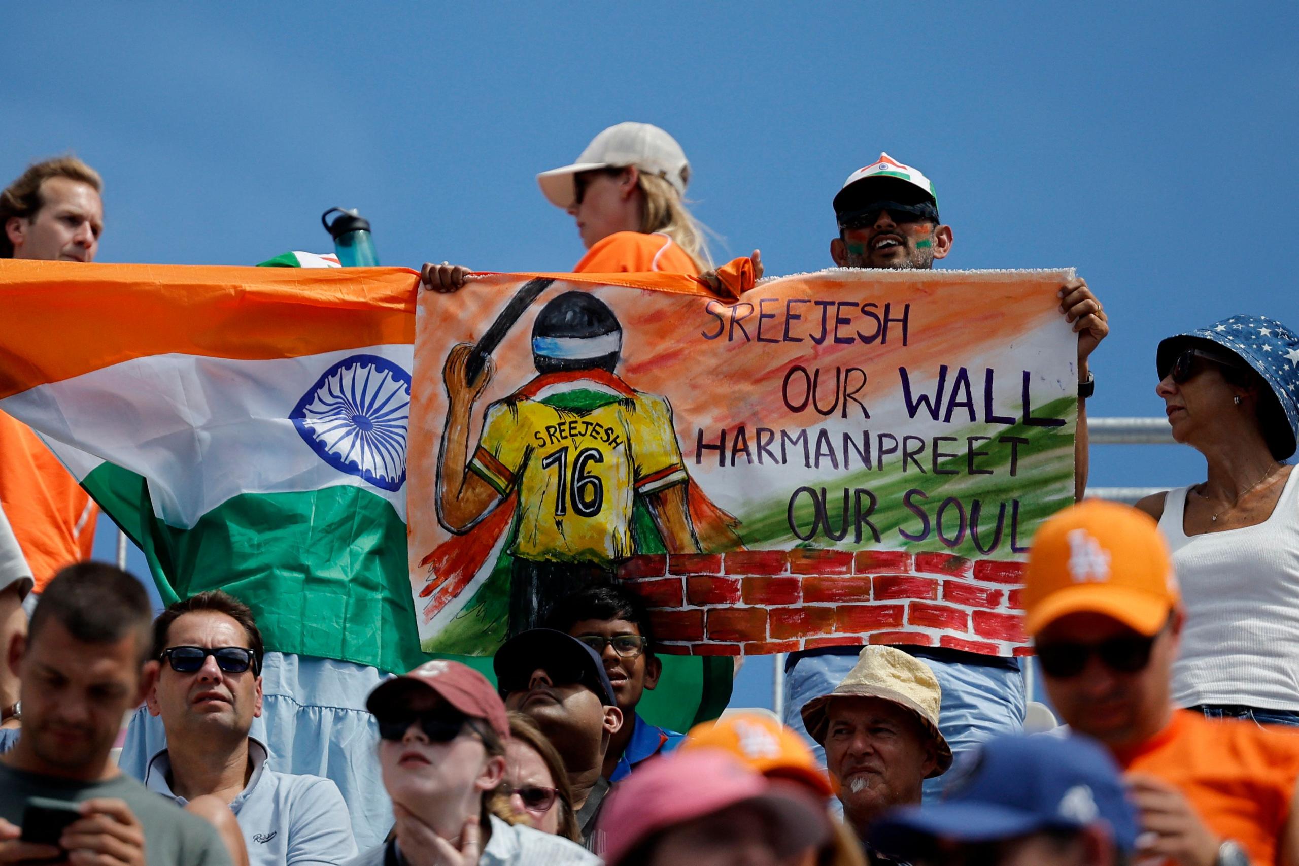 Paris 2024 Olympics - Hockey - Men's Bronze Medal Match - India vs Spain - Yves-du-Manoir Stadium, Colombes, France - August 08, 2024. An Indian fan holds up a banner supporting his team. 