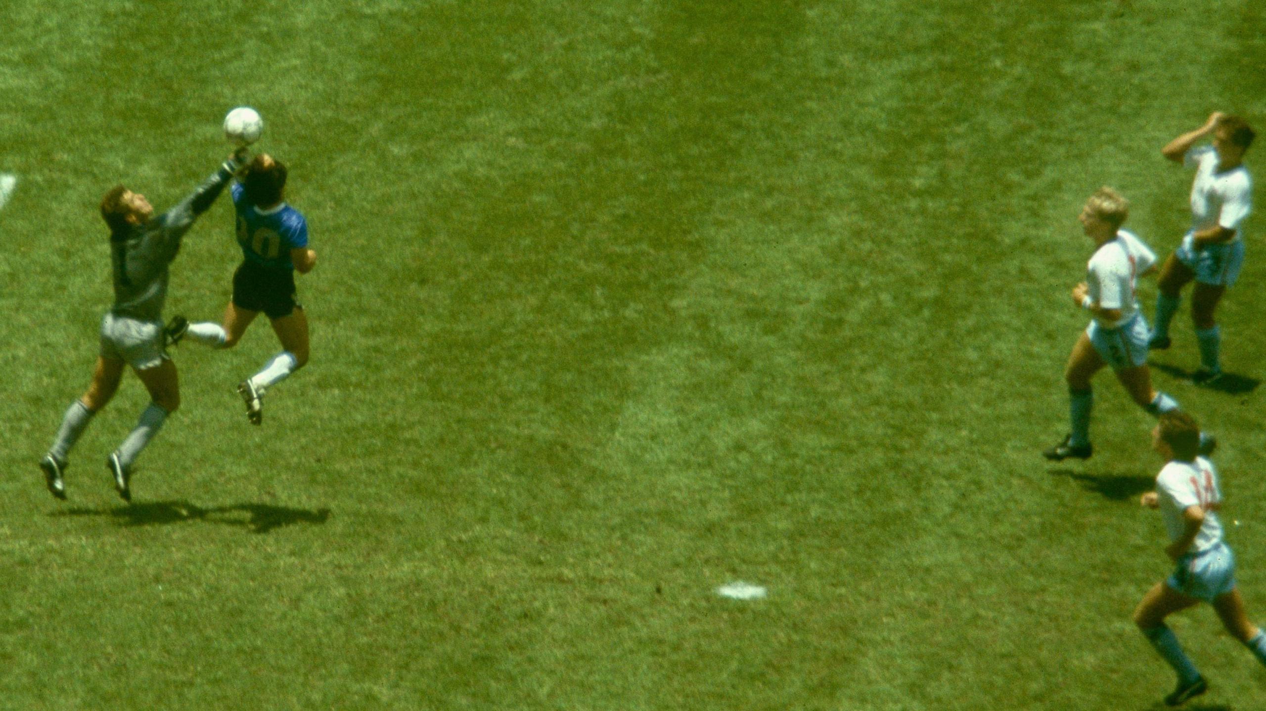 Diego Maradona scores his infamous goal for Argentina against England at the 1986 World Cup