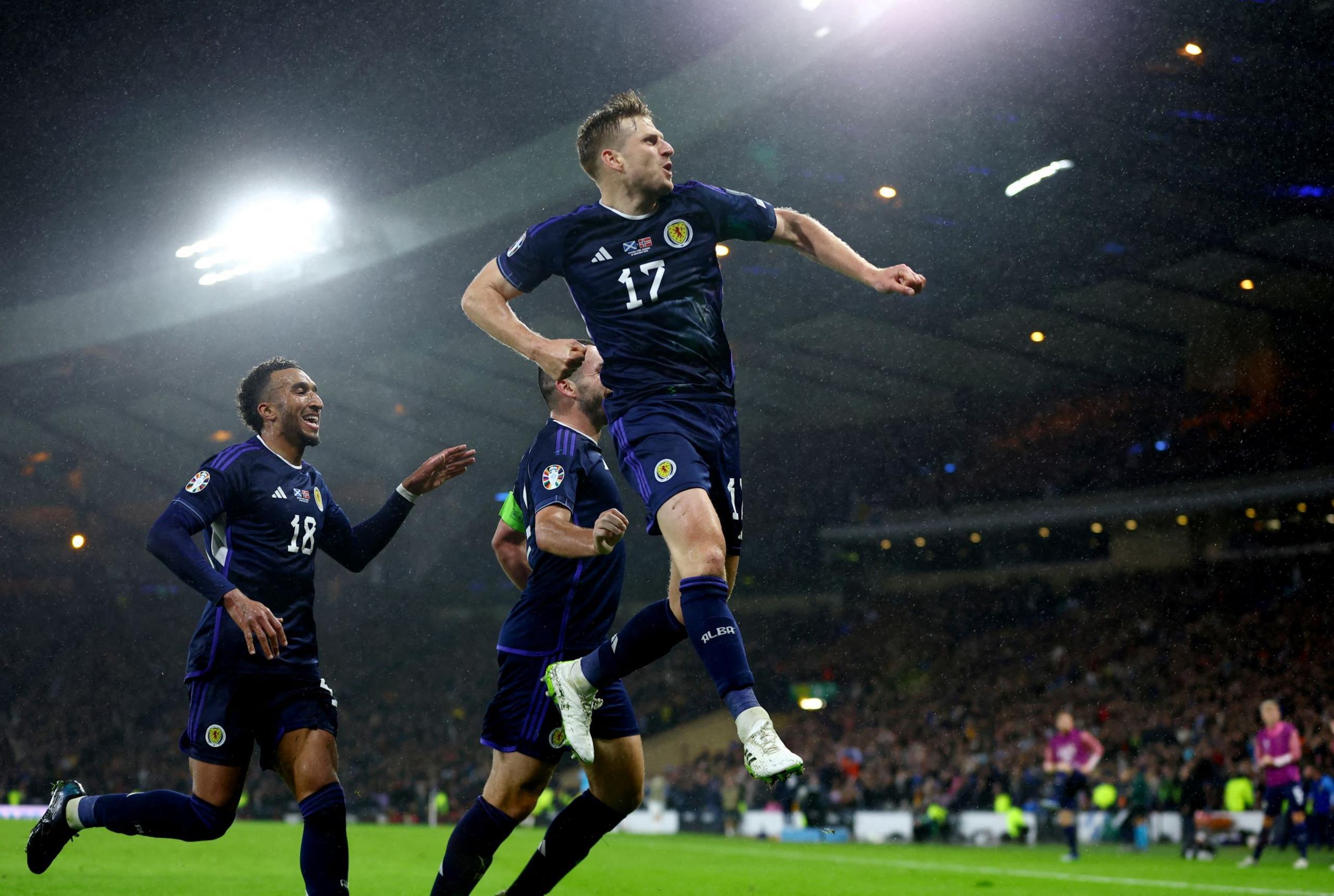 Scotland football team celebrate scoring a goal