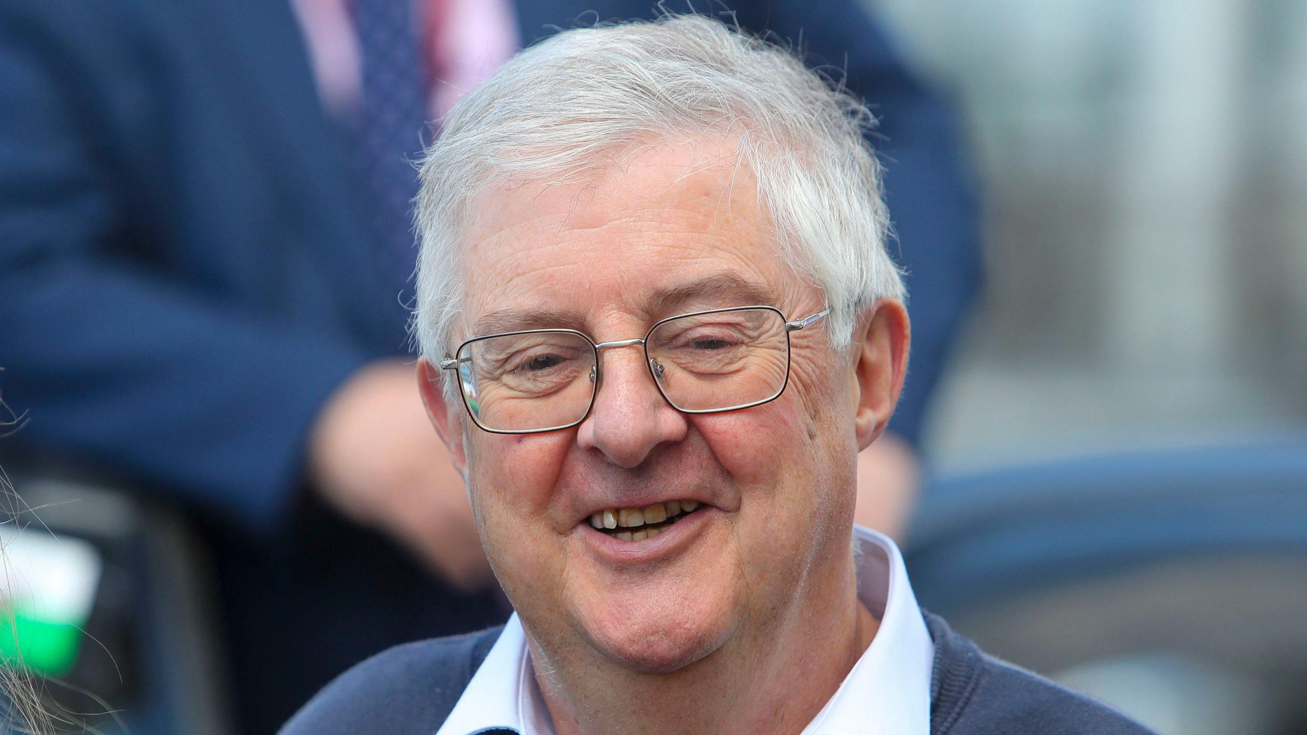 A head and shoulders picture of Mark Drakeford smiling.